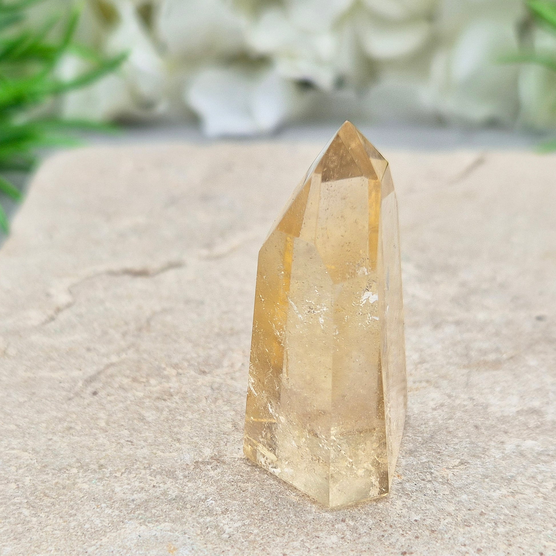Authentic Brazilian citrine crystal tower with a polished finish. Perfect for display, gifting, or curated crystal spaces.