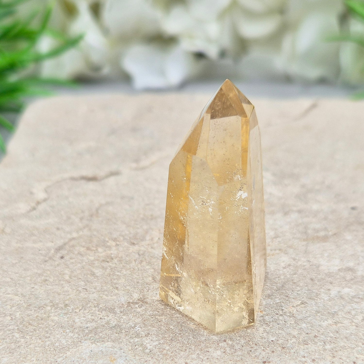 Authentic Brazilian citrine crystal tower with a polished finish. Perfect for display, gifting, or curated crystal spaces.