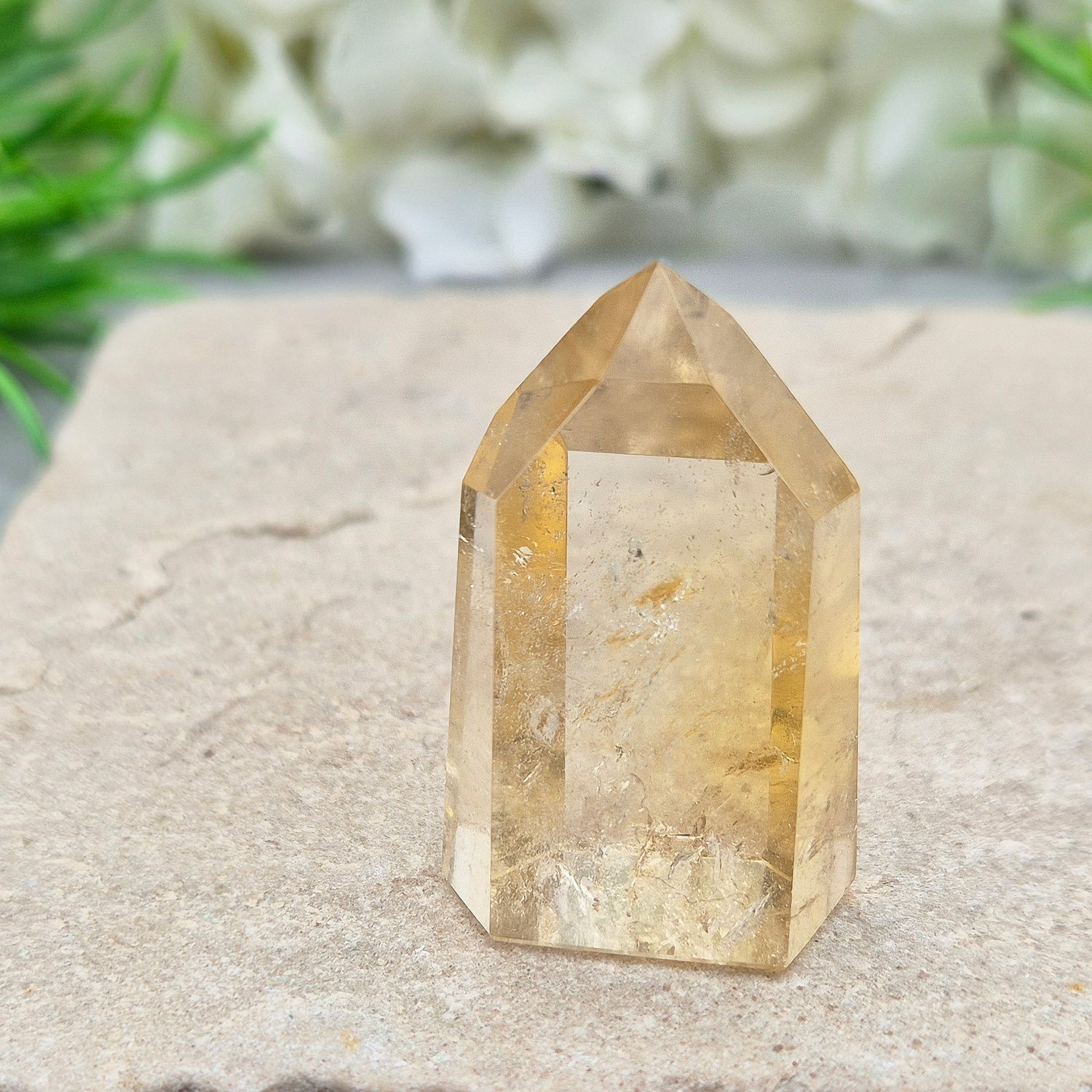 Authentic Brazilian citrine crystal tower with a polished finish. Perfect for display, gifting, or curated crystal spaces.