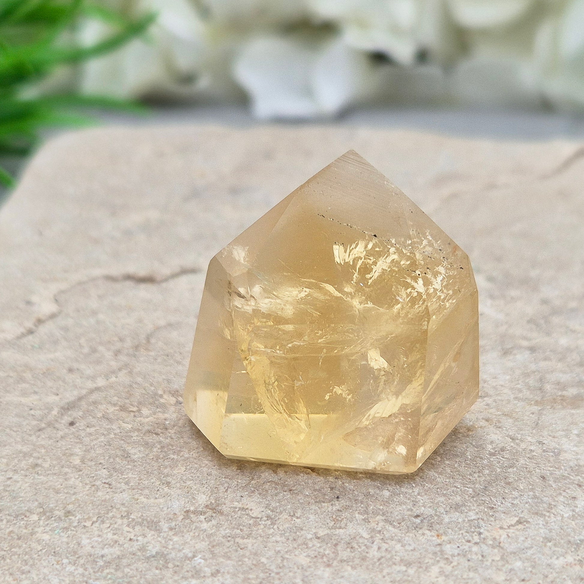 Genuine natural citrine crystal point, polished and sourced from Brazil. Ideal for crystal lovers, display, or mindful gifting.

