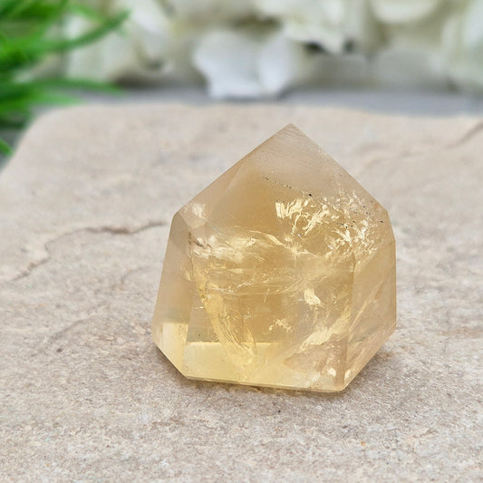 Genuine natural citrine crystal point, polished and sourced from Brazil. Ideal for crystal lovers, display, or mindful gifting.


