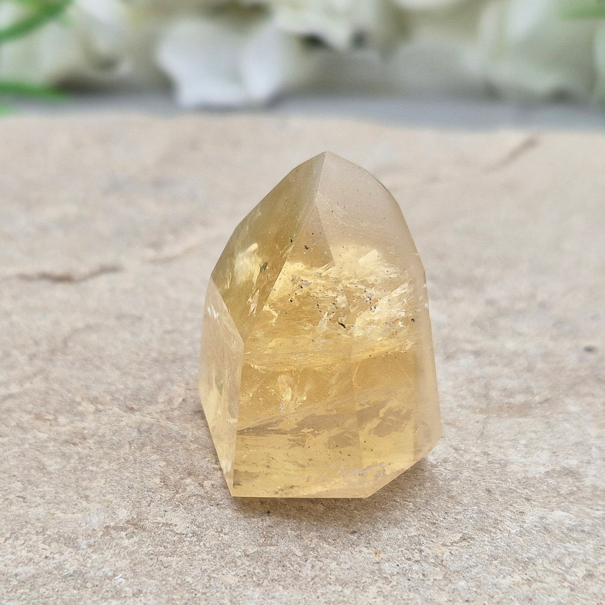 Genuine natural citrine crystal point, polished and sourced from Brazil. Ideal for crystal lovers, display, or mindful gifting.

