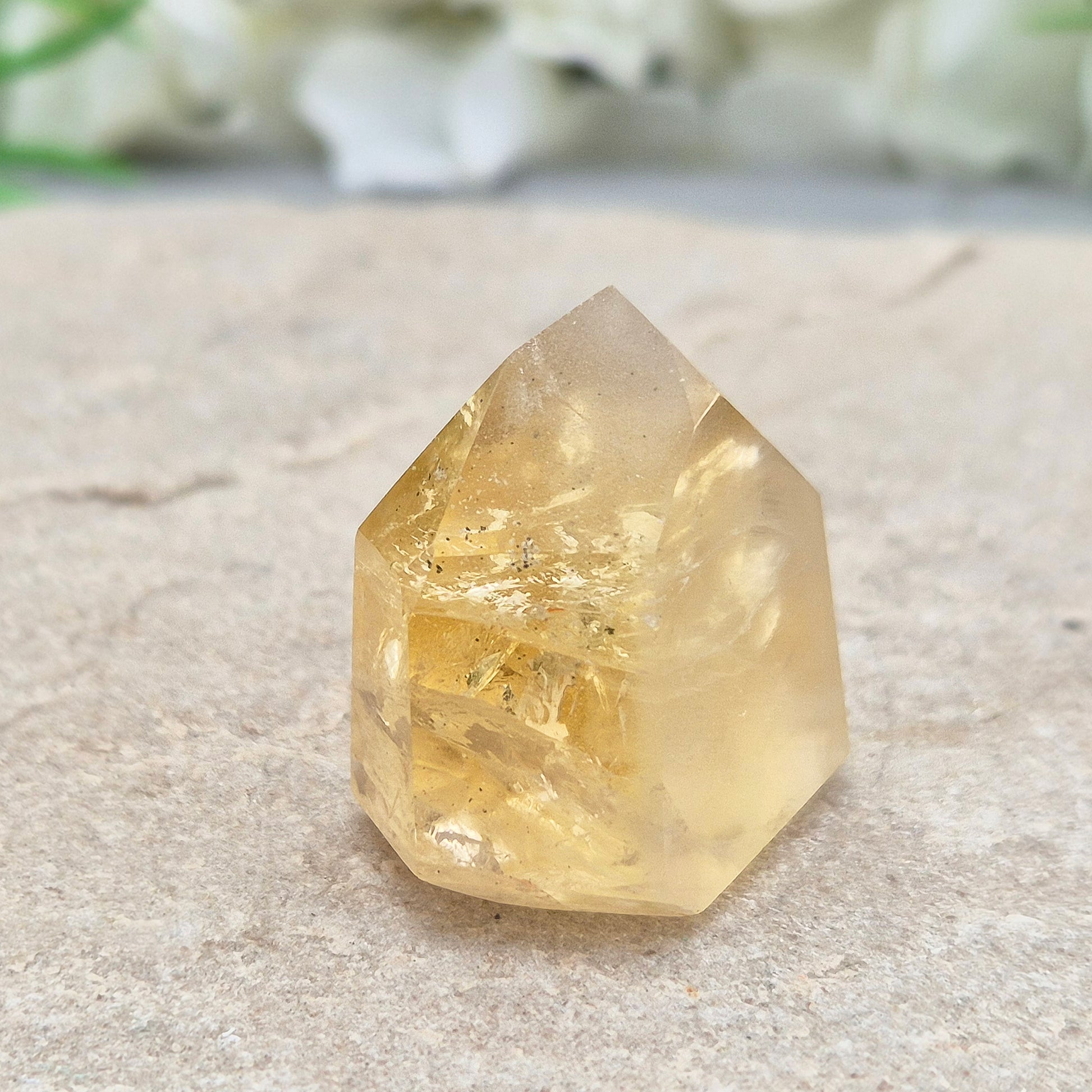Genuine natural citrine crystal point, polished and sourced from Brazil. Ideal for crystal lovers, display, or mindful gifting.

