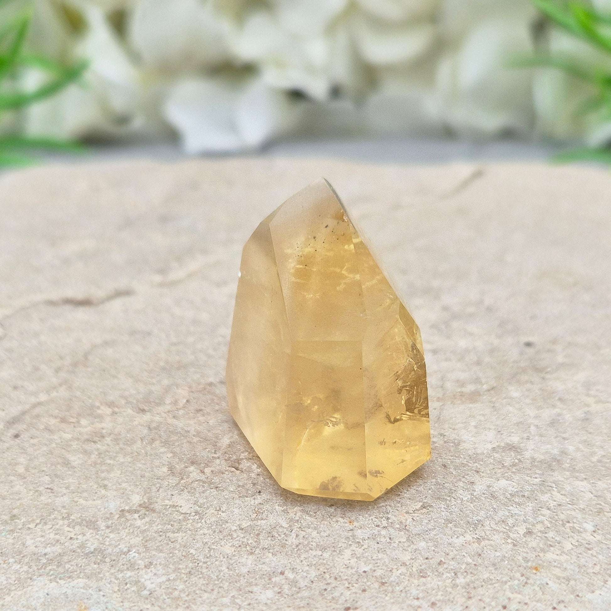 Genuine natural citrine crystal point, polished and sourced from Brazil. Ideal for crystal lovers, display, or mindful gifting.


