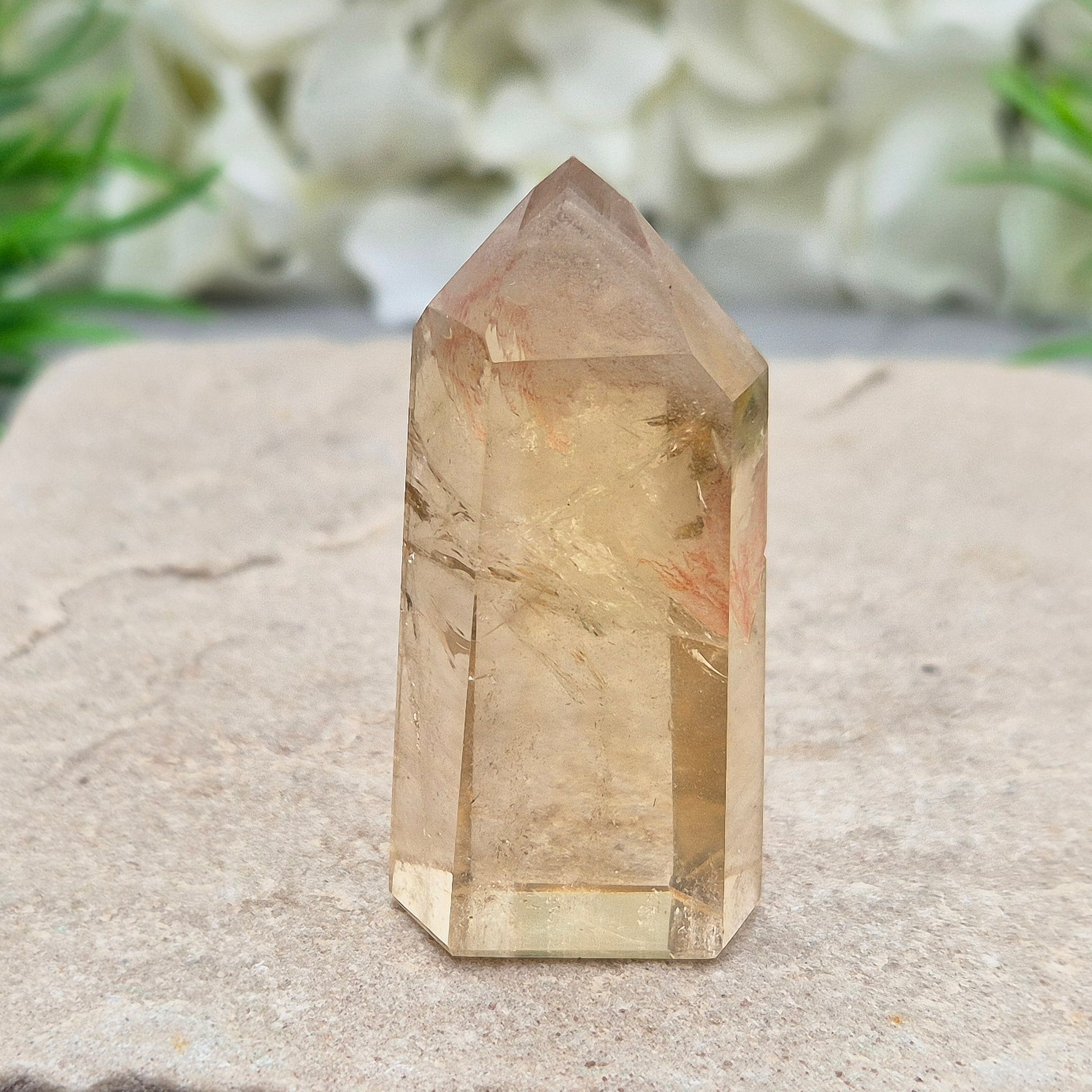 Natural Untreated polished Citrine Point sourced and polished in Brazil. Wonderful golden honey citrine colour with a phantom in the tip, a natural fissure at the back and light reflecting inclusions. 