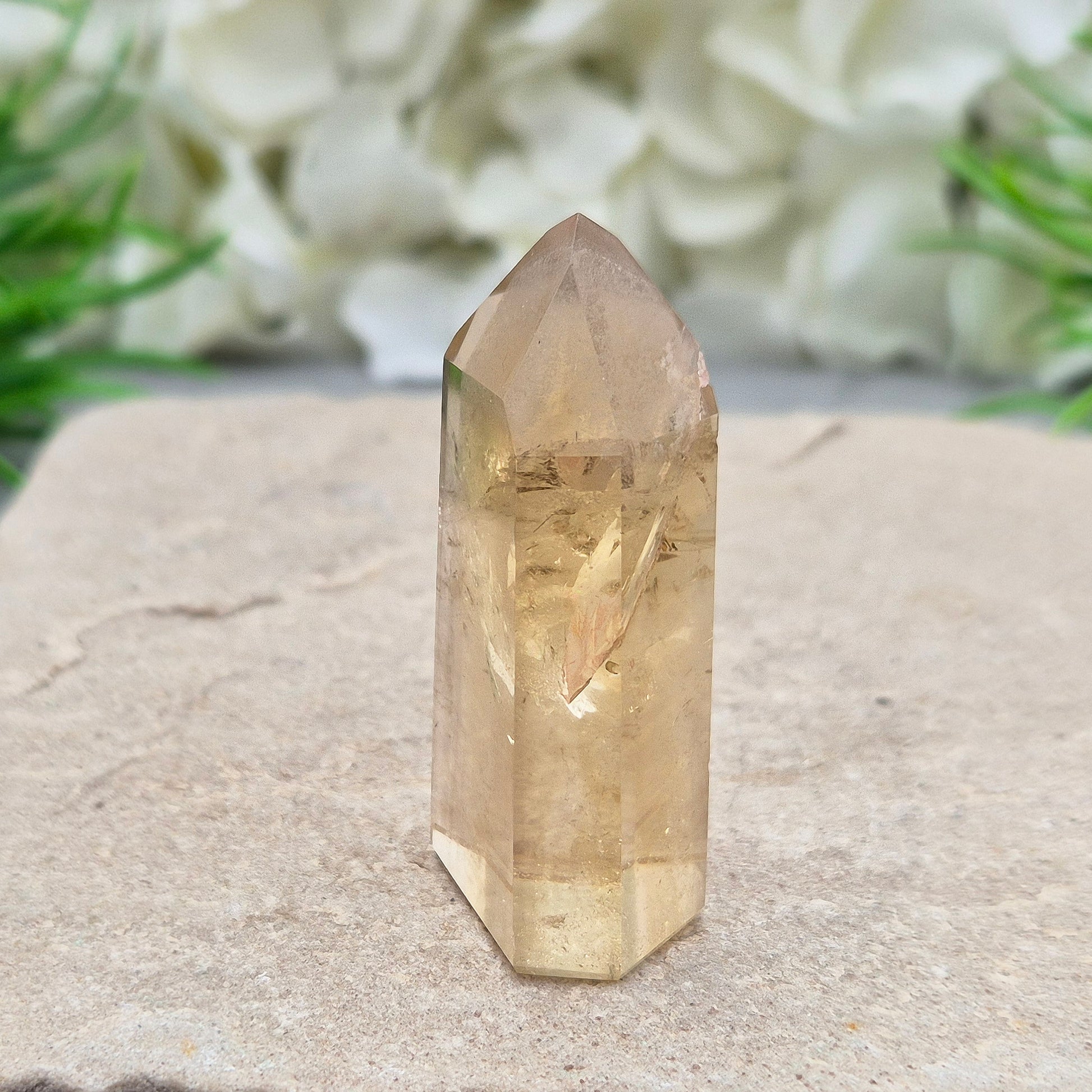 Natural Untreated polished Citrine Point sourced and polished in Brazil. Wonderful golden honey citrine colour with a phantom in the tip, a natural fissure at the back and light reflecting inclusions. 
