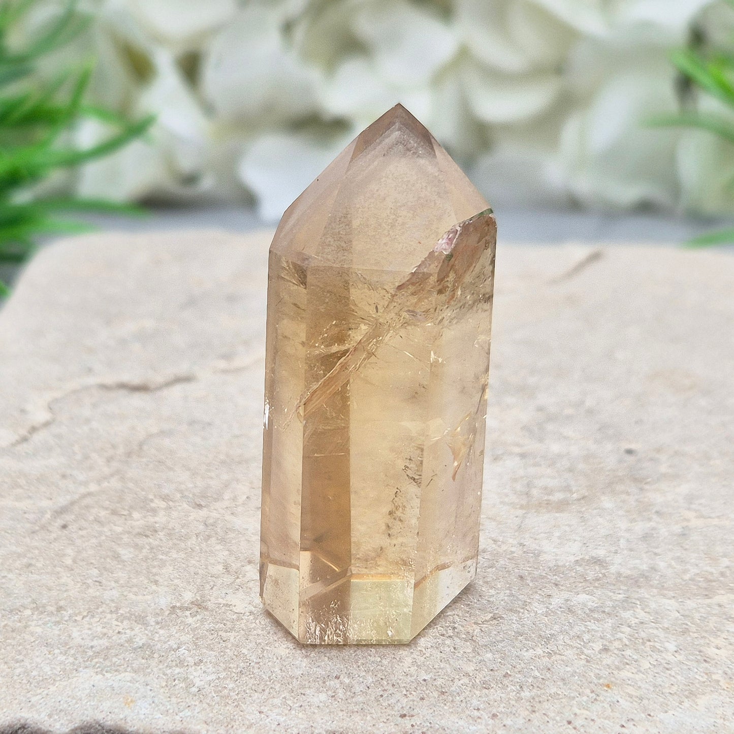 Natural Untreated polished Citrine Point sourced and polished in Brazil. Wonderful golden honey citrine colour with a phantom in the tip, a natural fissure at the back and light reflecting inclusions. 