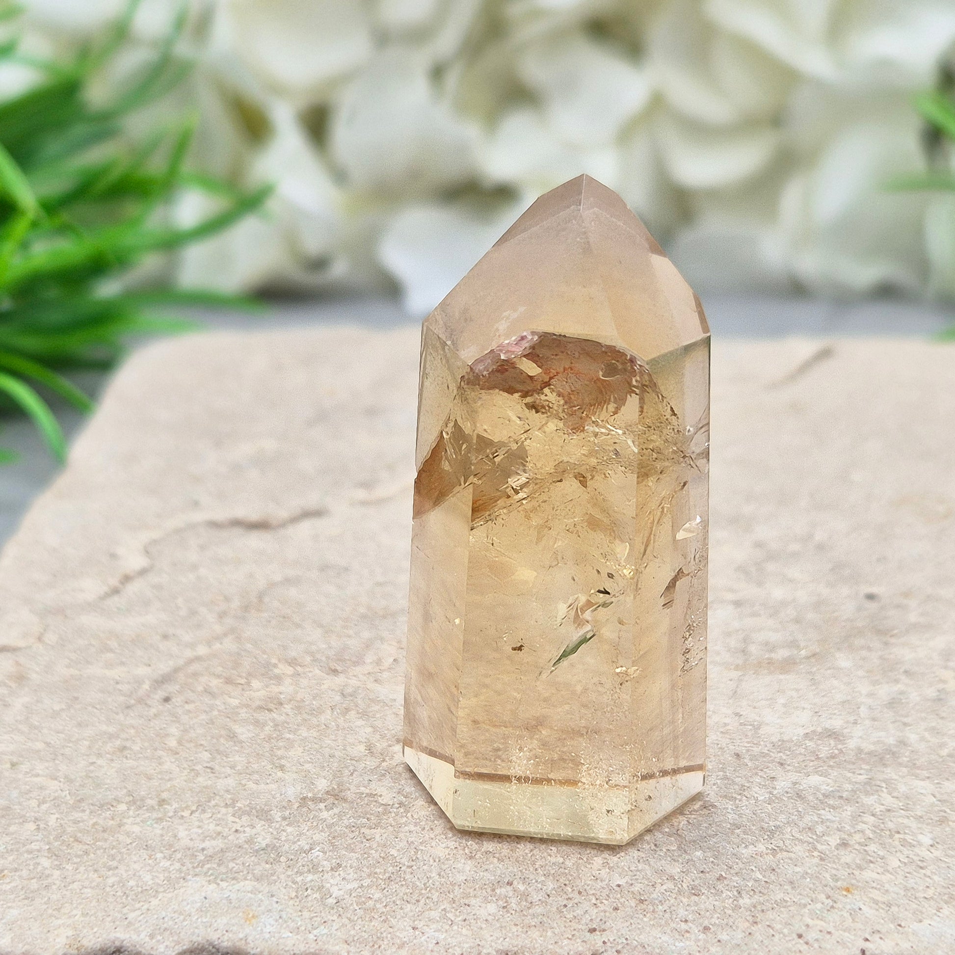 Natural Untreated polished Citrine Point sourced and polished in Brazil. Wonderful golden honey citrine colour with a phantom in the tip, a natural fissure at the back and light reflecting inclusions. 
