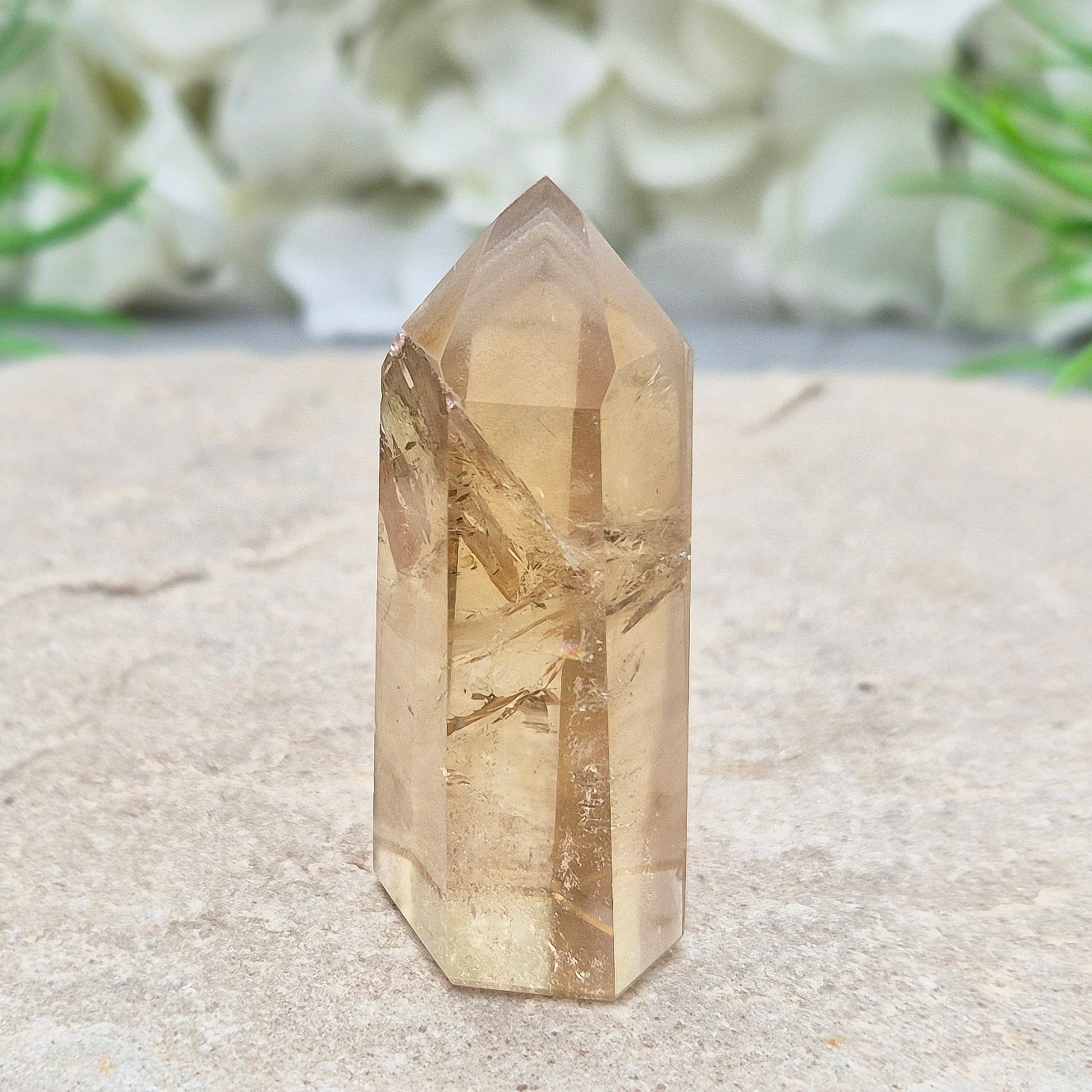 Natural Untreated polished Citrine Point sourced and polished in Brazil. Wonderful golden honey citrine colour with a phantom in the tip, a natural fissure at the back and light reflecting inclusions. 