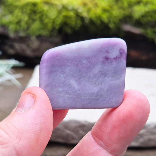 This rare Kammererite crystal slice is polished to reveal its striking purple-magenta colouring, often accented with natural green inclusions of Chromite, Chlorite, or Serpentine. Sometimes referred to as Purple Seraphinite