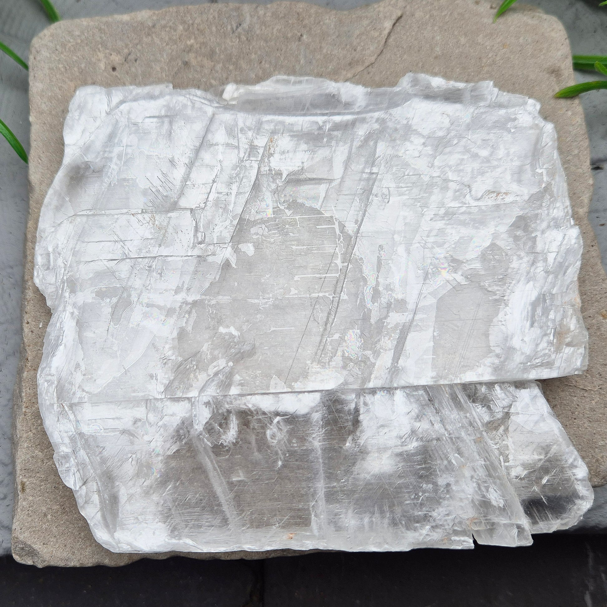 This striking Selenite Window, also known as “Utah Ice,” comes directly from the Glitter Mountain site on the Utah-Arizona border. Naturally formed with exceptional clarity and shine, these high-quality pieces are carefully selected for their purity and luminous appearance.