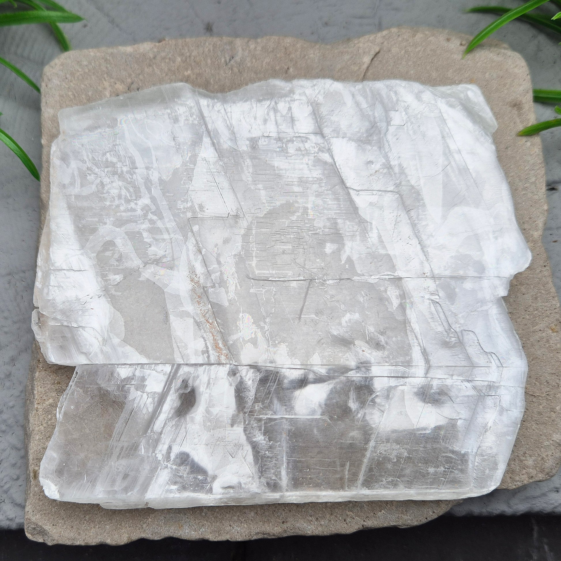 This striking Selenite Window, also known as “Utah Ice,” comes directly from the Glitter Mountain site on the Utah-Arizona border. Naturally formed with exceptional clarity and shine, these high-quality pieces are carefully selected for their purity and luminous appearance.