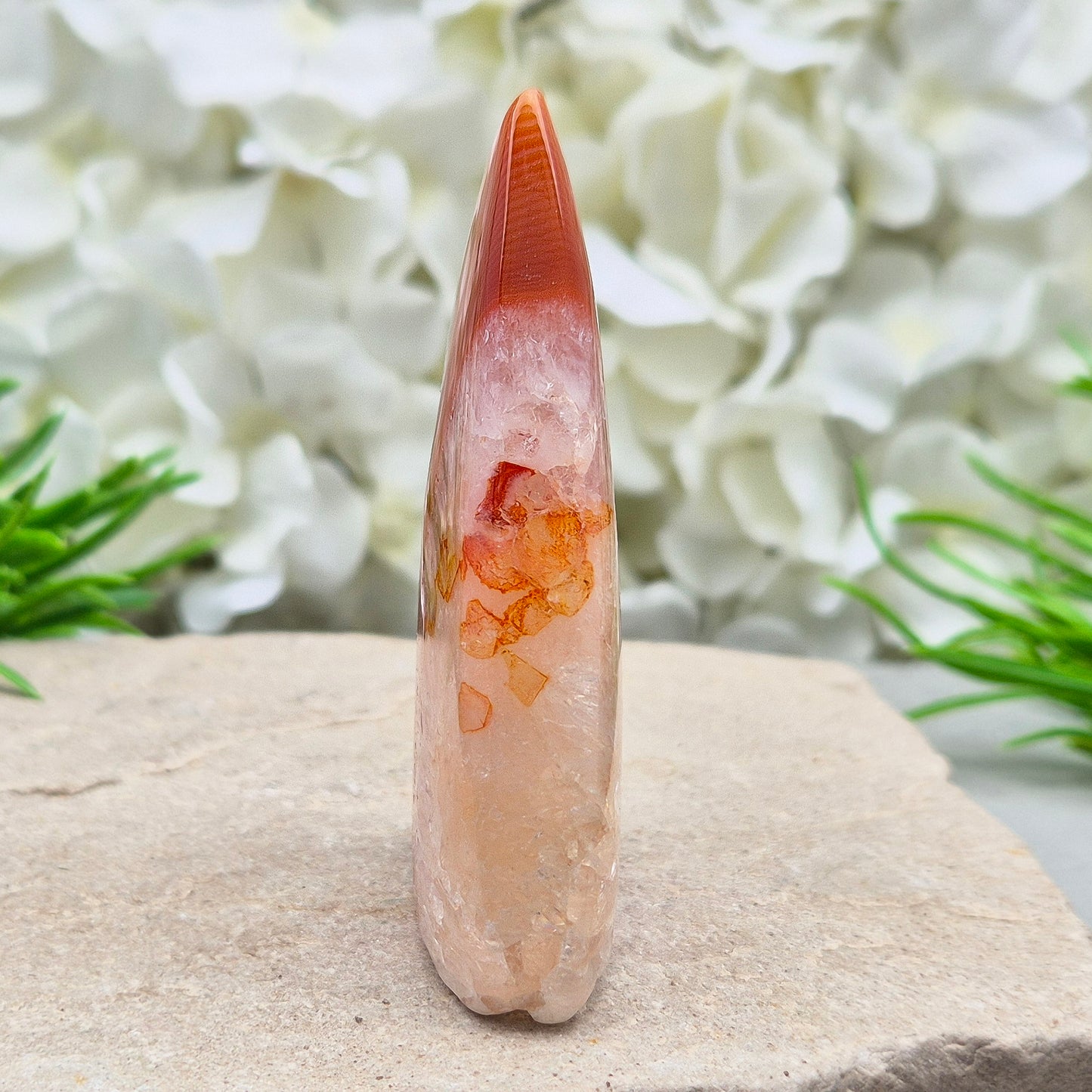 Red Banded Agate Flame with Quartz. This beautiful polished, flame-shaped crystal features bands of red and orange agate alongside quartz.
