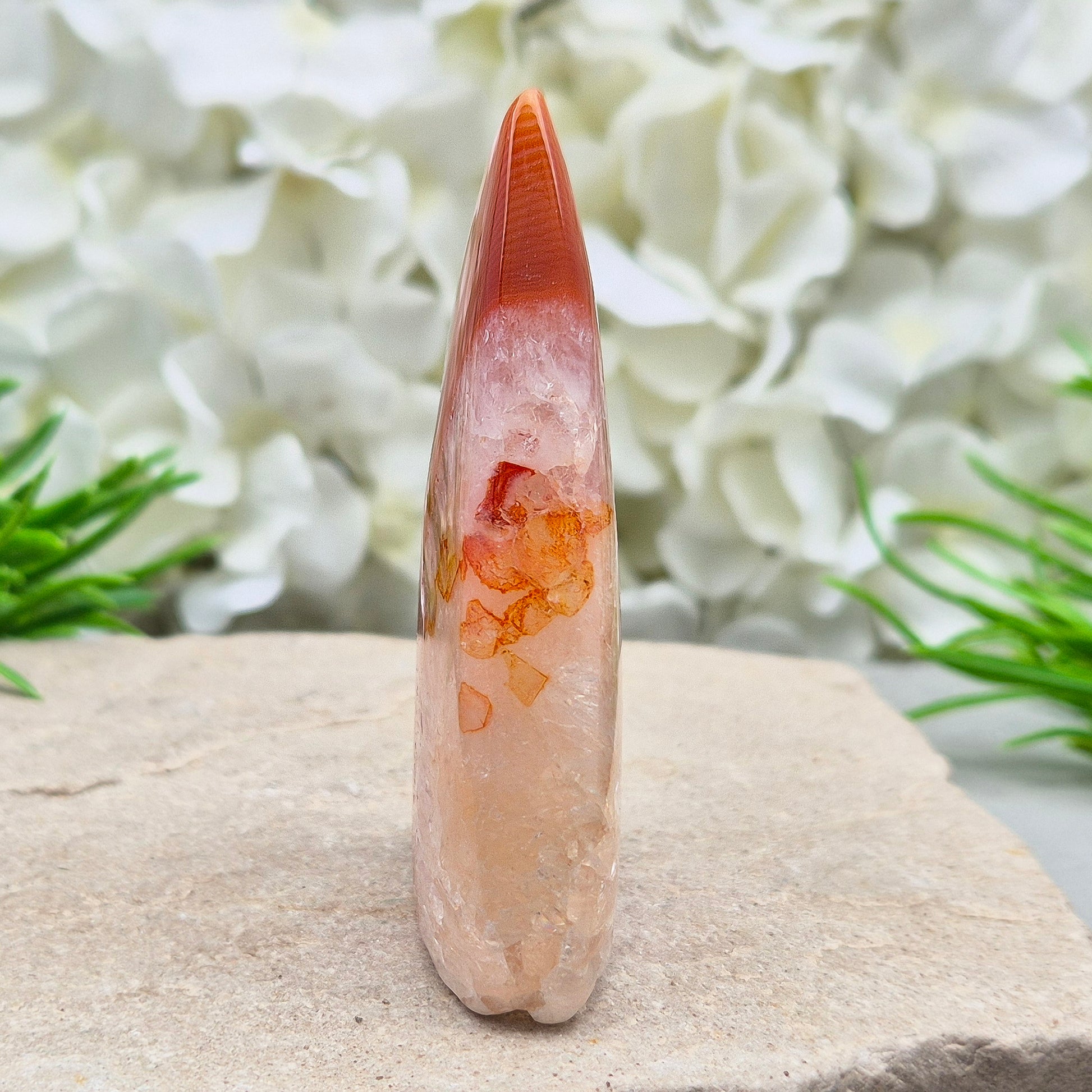 Red Banded Agate Flame with Quartz. This beautiful polished, flame-shaped crystal features bands of red and orange agate alongside quartz.
