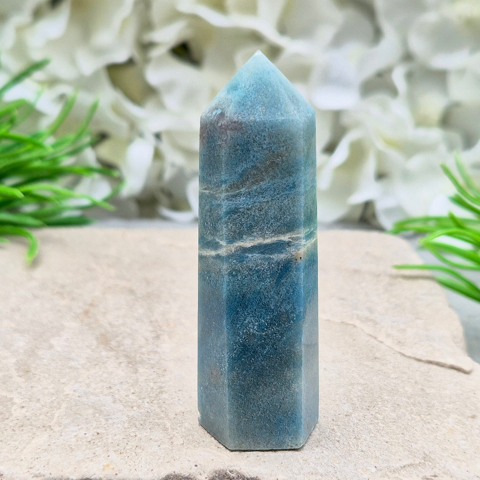This beautiful Trolleite Point/Tower comes from Brazil, showcasing its calming bluish-gray hues. Perfectly balanced for energy work, this point is designed to direct and amplify energy upright and outward. Trolleite is cherished for its ability to promote focus, calm the mind, and deepen spiritual connection.