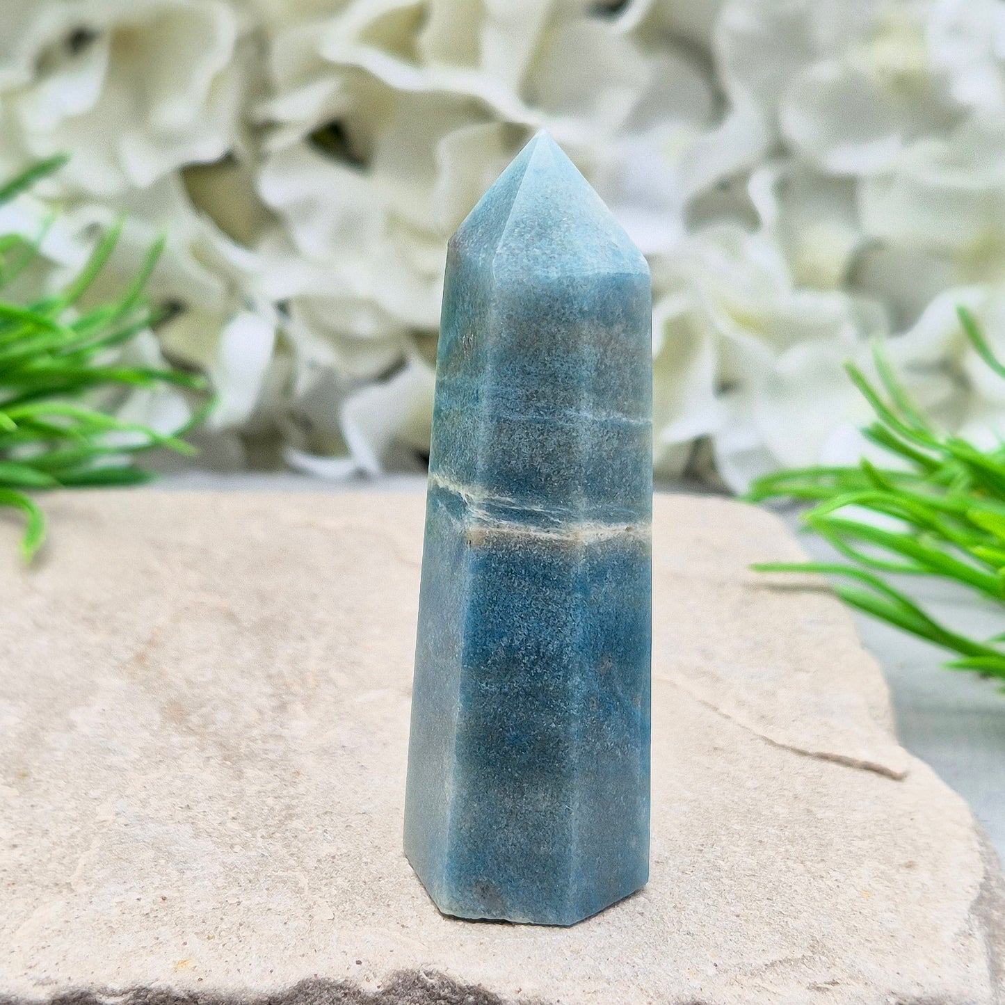 This beautiful Trolleite Point/Tower comes from Brazil, showcasing its calming bluish-gray hues. Perfectly balanced for energy work, this point is designed to direct and amplify energy upright and outward. Trolleite is cherished for its ability to promote focus, calm the mind, and deepen spiritual connection.
