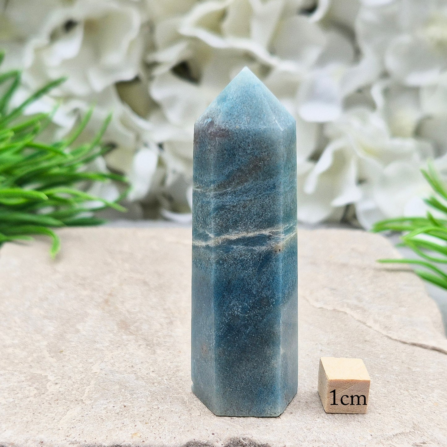 This beautiful Trolleite Point/Tower comes from Brazil, showcasing its calming bluish-gray hues. Perfectly balanced for energy work, this point is designed to direct and amplify energy upright and outward. Trolleite is cherished for its ability to promote focus, calm the mind, and deepen spiritual connection.