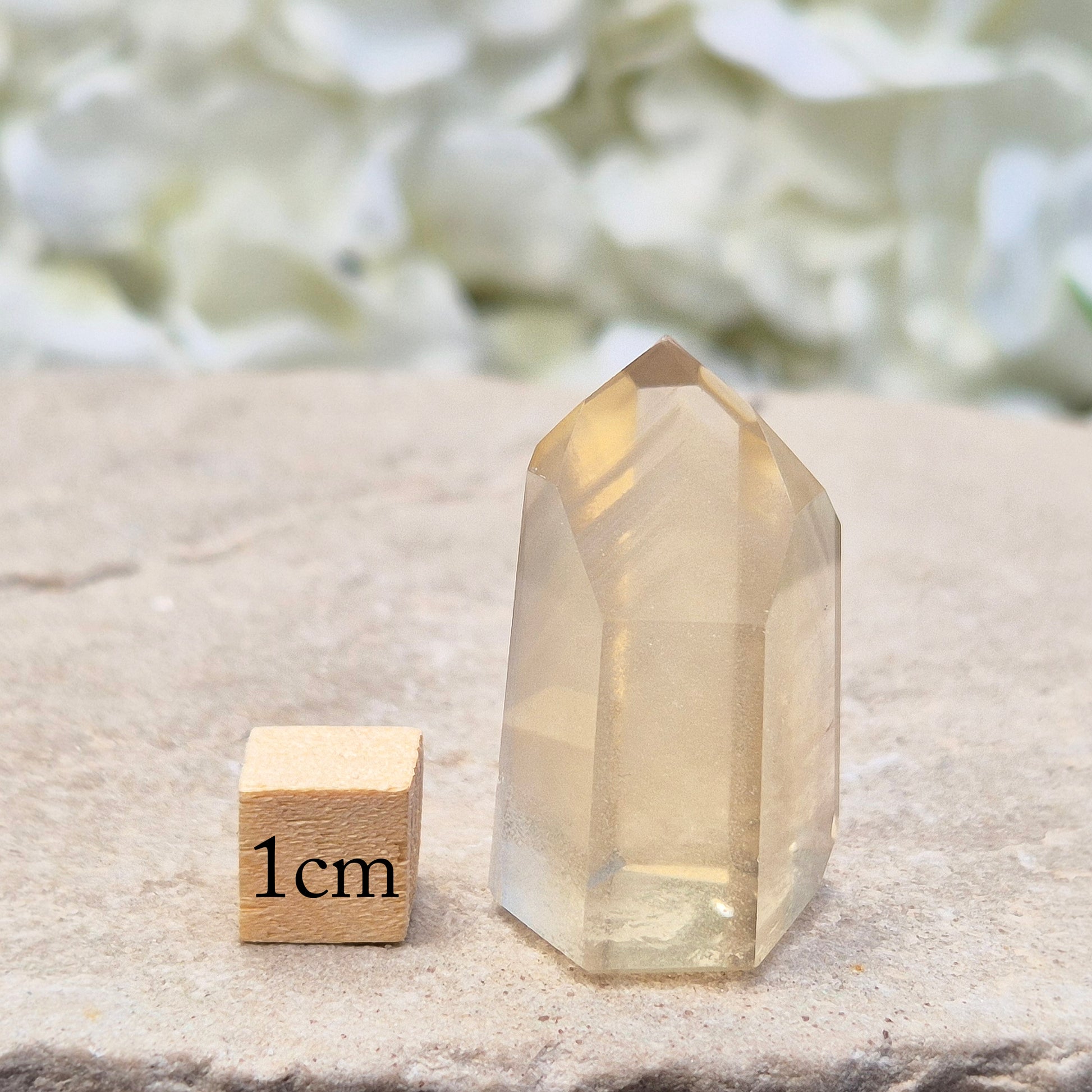 This small, striking pale honey Citrine point is completely natural (not heat-treated) and has been polished to reveal its subtle phantom inclusions – layered growth lines formed over time 