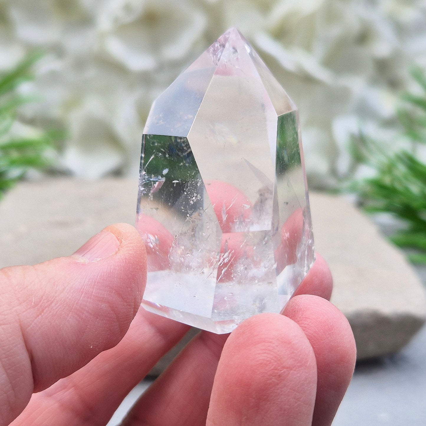 Clear Quartz Polished Point – From Brazil. This beautiful Quartz point is polished to enhance its natural clarity, and there looks to be a small phantom at the base of it.