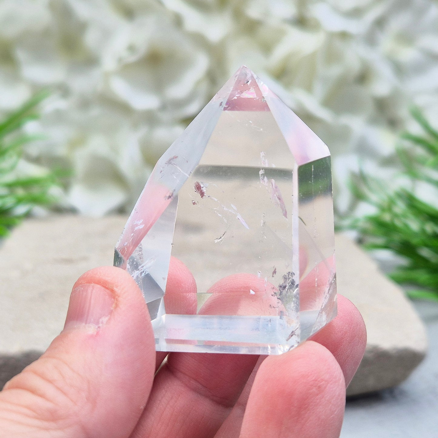 Clear Quartz Polished Point – From Brazil. This beautiful Quartz point is polished to enhance its natural clarity, and there looks to be a small phantom at the base of it.