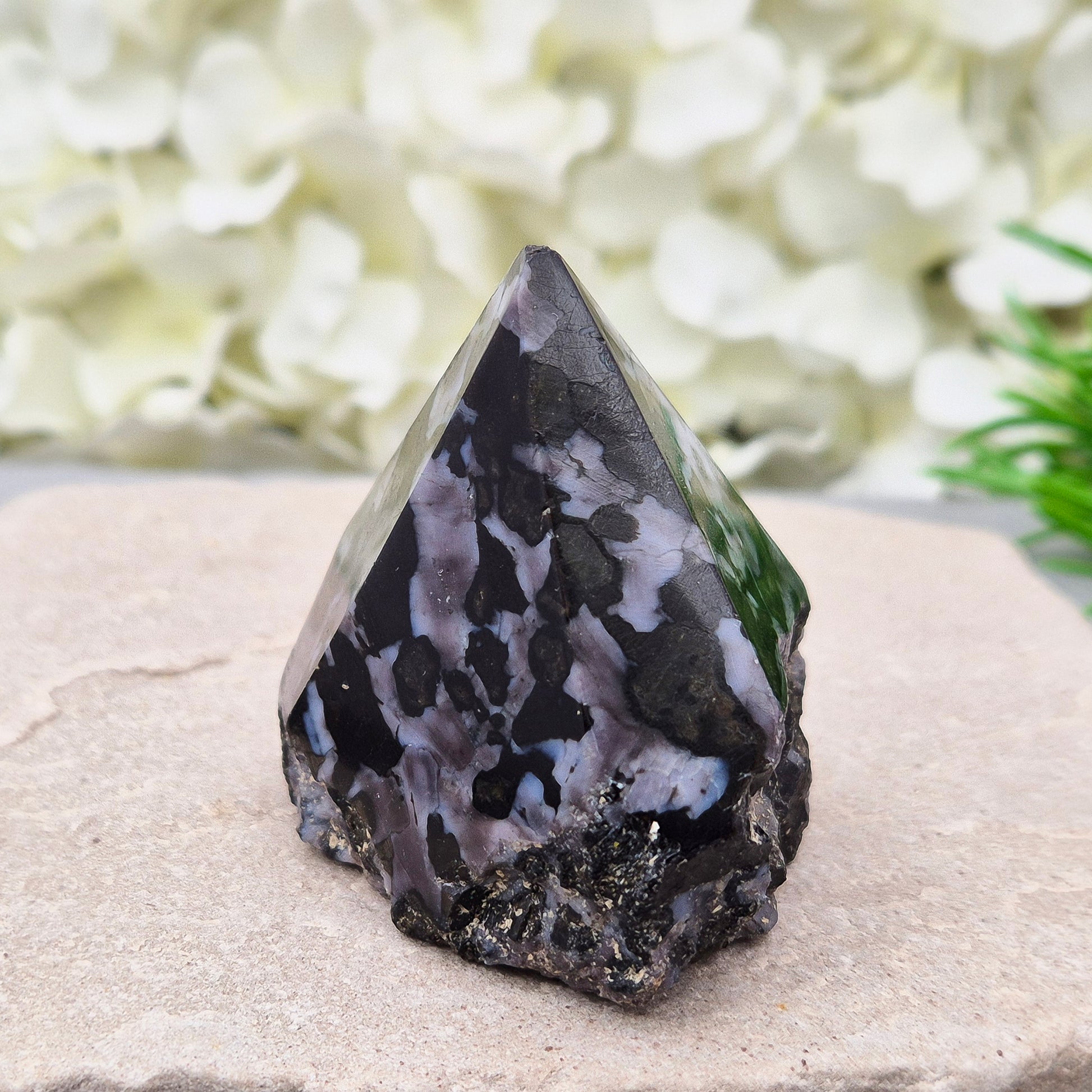 Indigo Gabbro Crystal Point (Mystic Merlinite) from Madagascar. This Indigo Gabbro point features a mix of dark black and deep purple colours. The top is polished, the base cut flat, and the sides left natural.