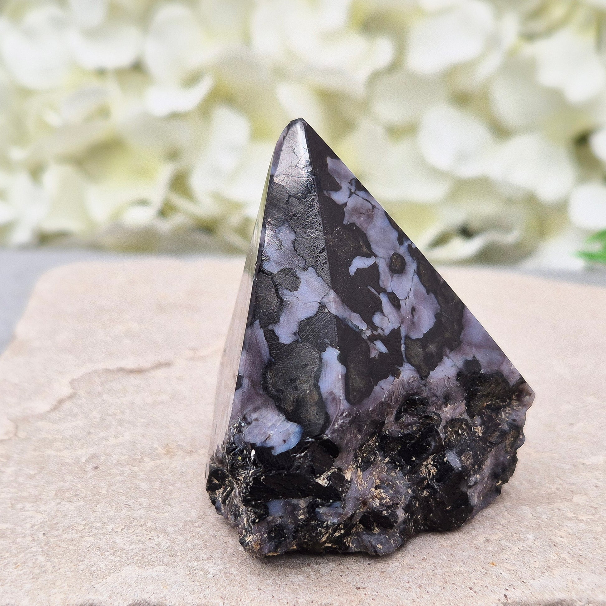 Indigo Gabbro Crystal Point (Mystic Merlinite) from Madagascar. This Indigo Gabbro point features a mix of dark black and deep purple colours. The top is polished, the base cut flat, and the sides left natural.