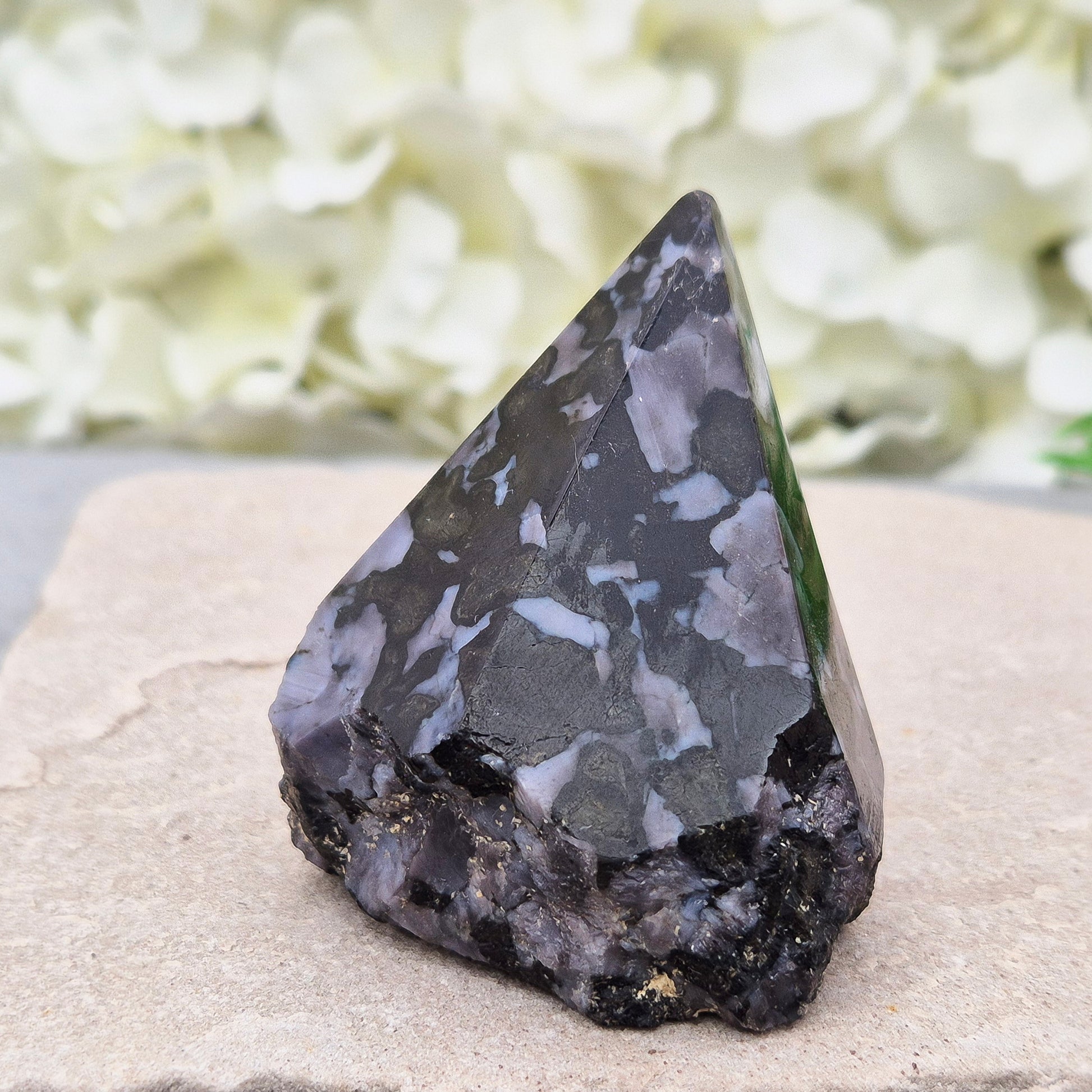 Indigo Gabbro Crystal Point (Mystic Merlinite) from Madagascar. This Indigo Gabbro point features a mix of dark black and deep purple colours. The top is polished, the base cut flat, and the sides left natural.