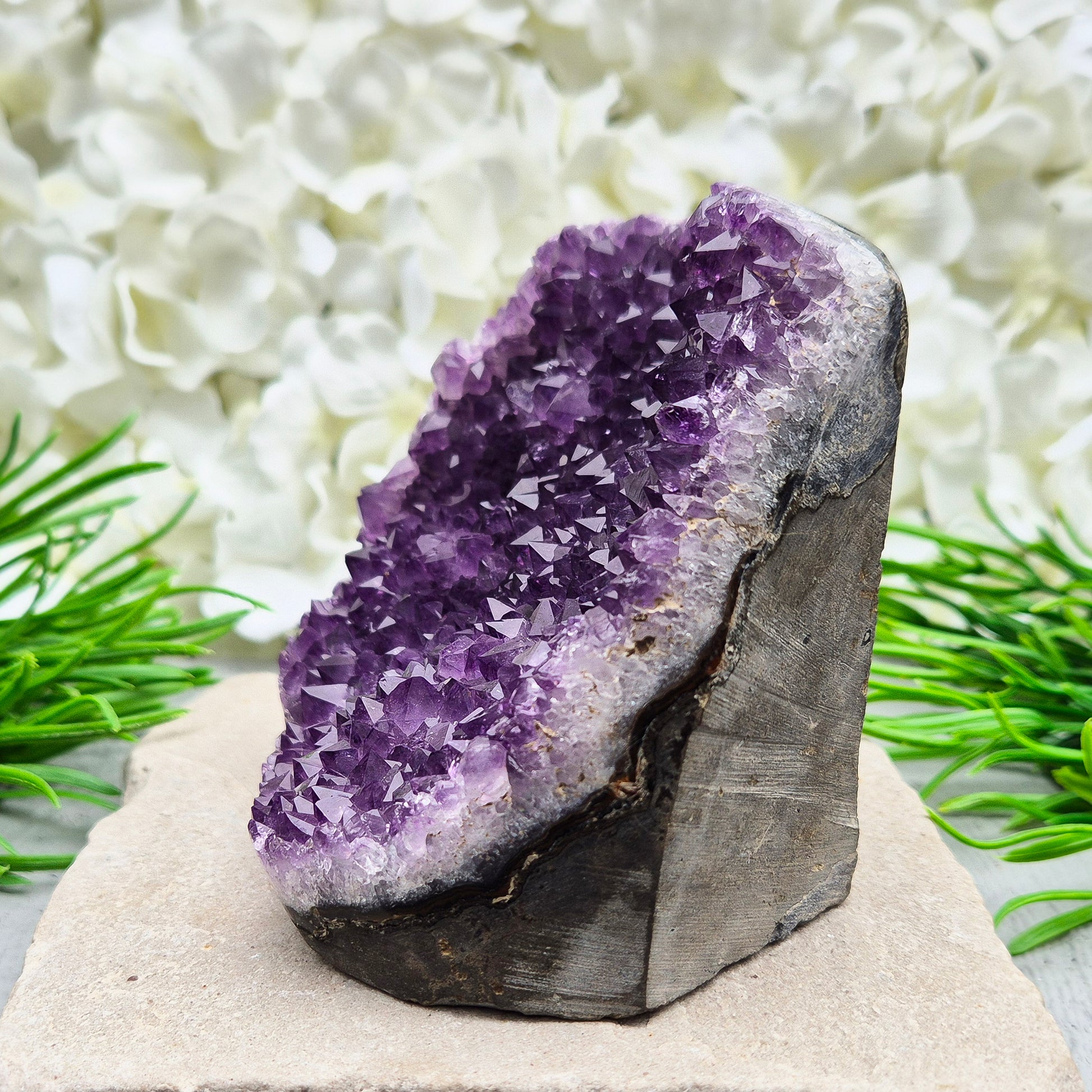 This beautiful self-standing Amethyst Geode from Brazil features lovely purple points and a natural open-face formation. 