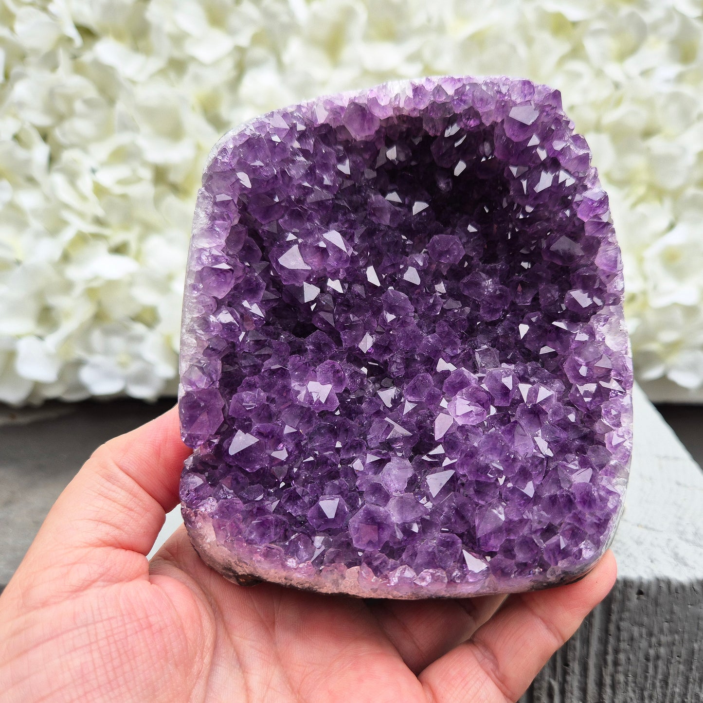 This beautiful self-standing Amethyst Geode from Brazil features lovely purple points and a natural open-face formation. 