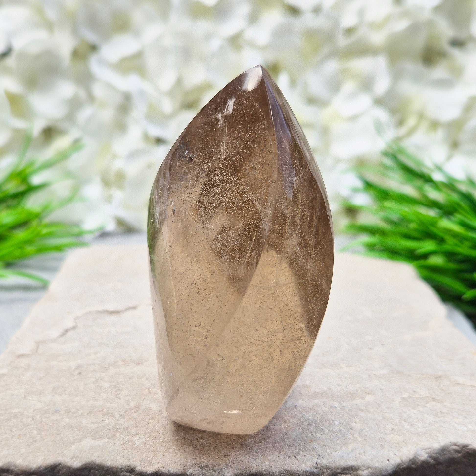 This polished Smoky Quartz Crystal Flame from Brazil features a light brown tone with subtle, light-reflecting inclusions and an amazing rainbow. It’s not heat-treated — this is genuine, naturally formed Smoky Quartz. 