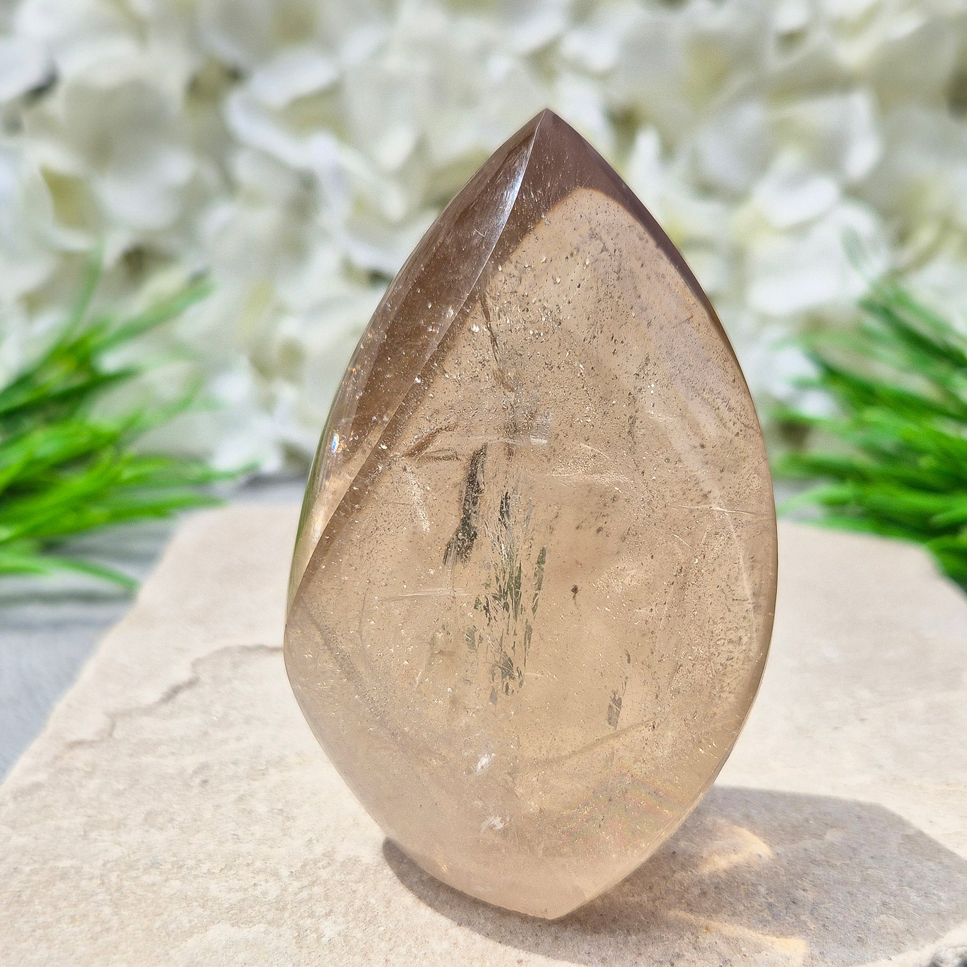 This polished Smoky Quartz Crystal Flame from Brazil features a light brown tone with subtle, light-reflecting inclusions and an amazing rainbow. It’s not heat-treated — this is genuine, naturally formed Smoky Quartz. 