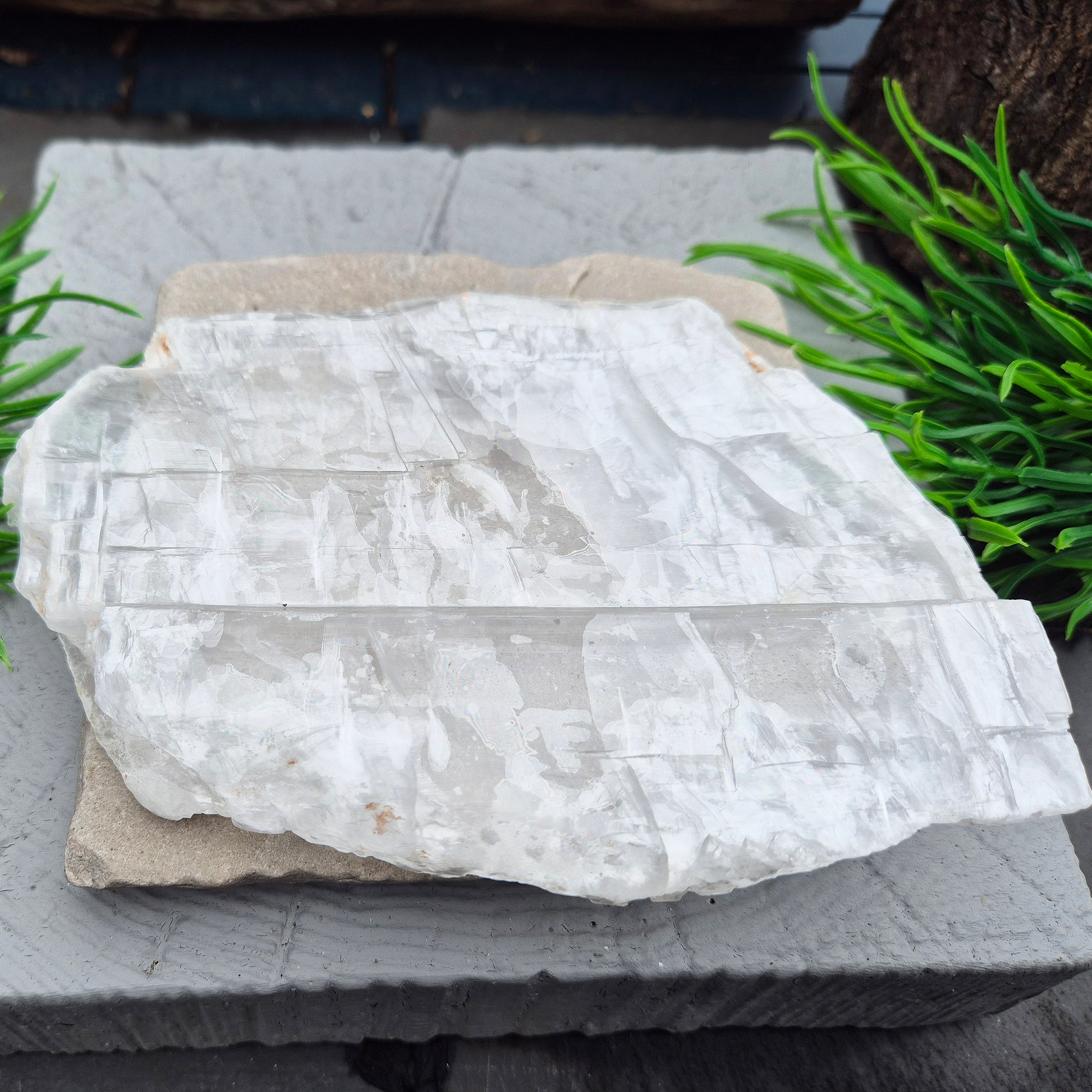 This striking Selenite Window — also known as Utah Ice — comes directly from the Glitter Mountain site near the Utah-Arizona border. It’s a true collector’s piece, naturally smooth with a glossy, high-lustre finish and exceptional internal clarity. 