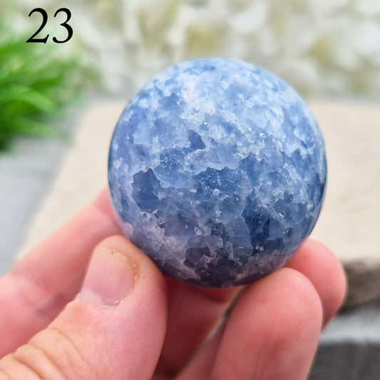 This polished Blue Calcite crystal from Madagascar has a lovely blue colouring and a rounded, spherical like shape that fits naturally into the palm. It carries a comforting, wave-like energy — peaceful, steady, and easy to be around.