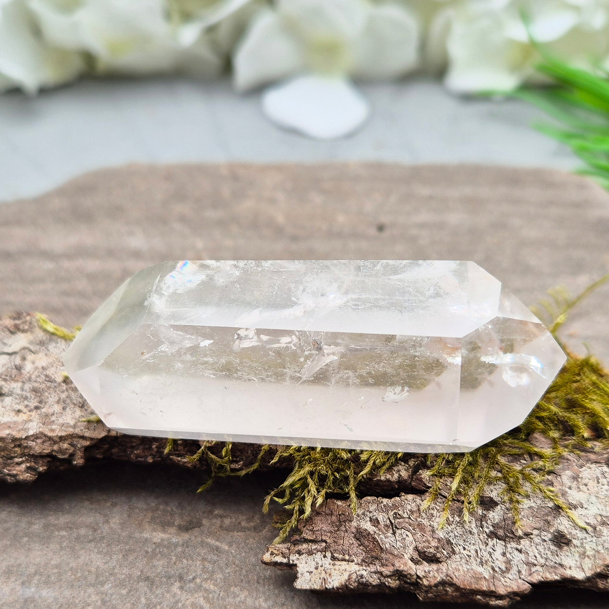 Quartz Crystal Double Terminated Wand, has a rainbow within it bringing a joyous nurturing vibration to an already great healing tool. Two sides are frosted.