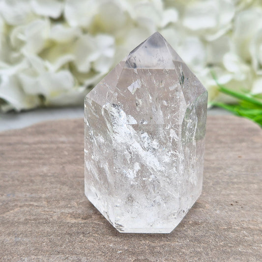 This Clear Quartz Polished Point is a radiant, light-filled crystal with clarity, sparkle, and high vibration A striking example of Brazilian Quartz. 