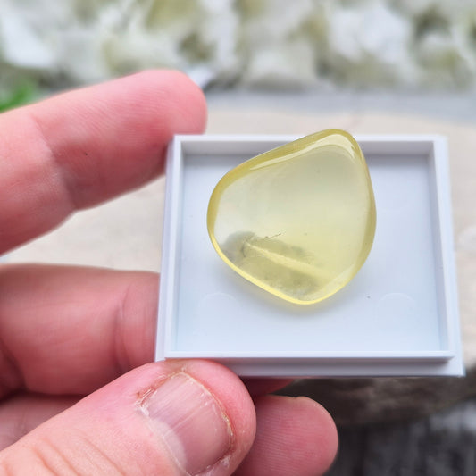 A rarer form of quartz with a distinctive olive-green tone, this Ouro Verde Quartz comes ready to display in a clear sample box (which can be removed if you prefer to carry or grid with it). 