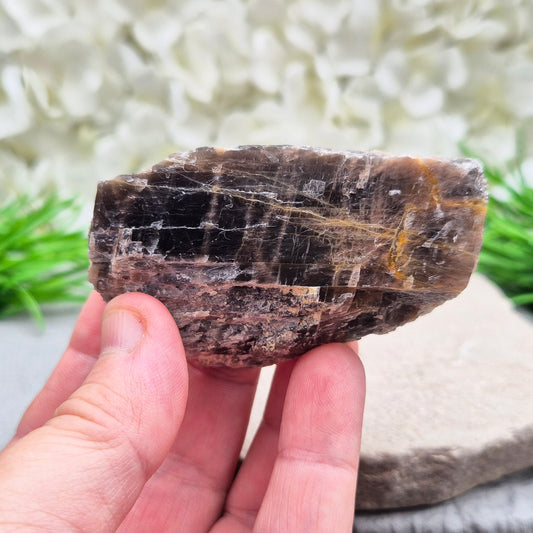 Black Moonstone from Madagascar. This natural piece features deep grey to black tones with a subtle shimmer. A unique variety of moonstone, it’s known for its grounding and reflective qualities.