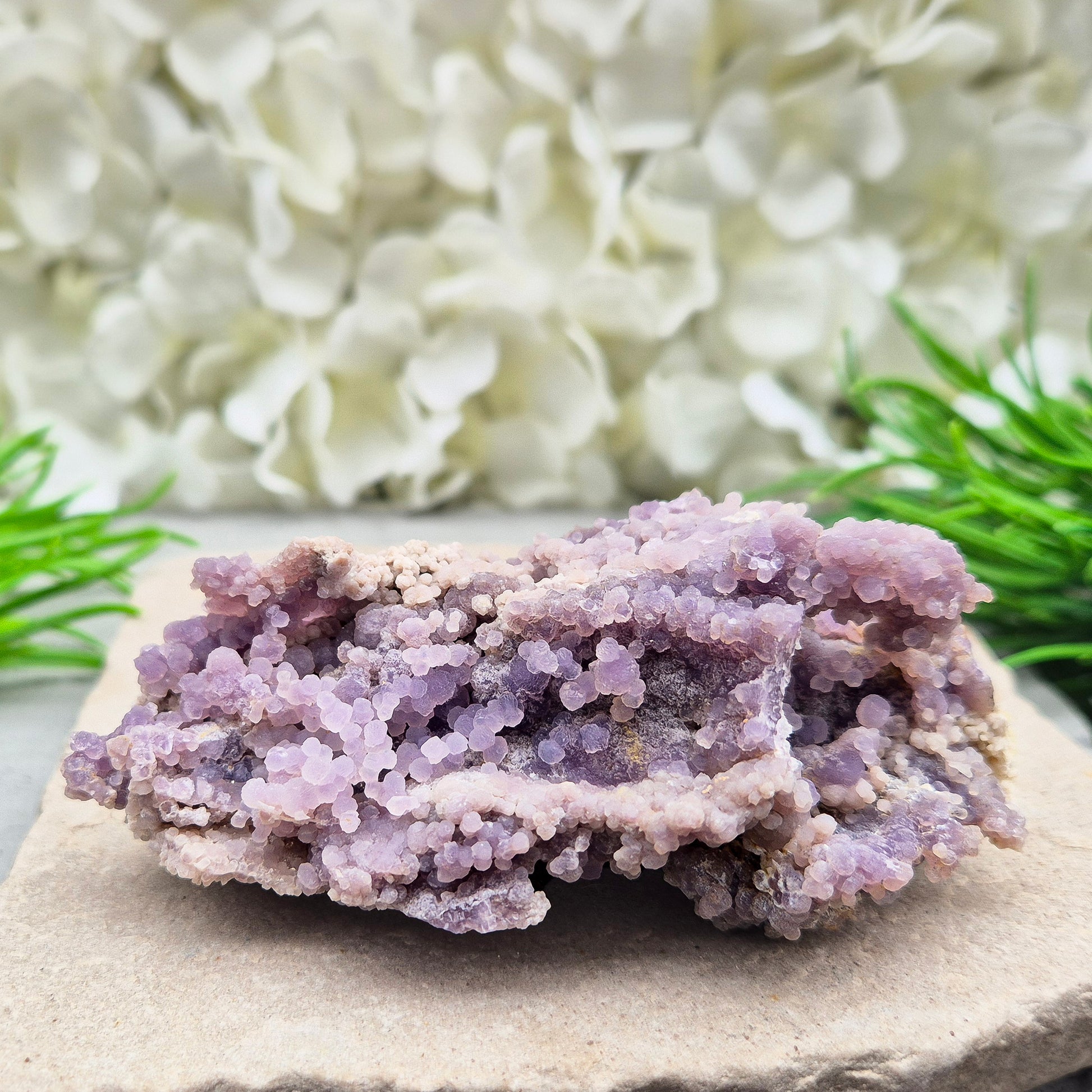 This beautiful Grape Agate cluster (also known as Purple Chalcedony or Botryoidal Purple Chalcedony) comes from Indonesia. Its natural ‘grape-like’ formations are made up of tiny rounded crystals that have grown closely together. 