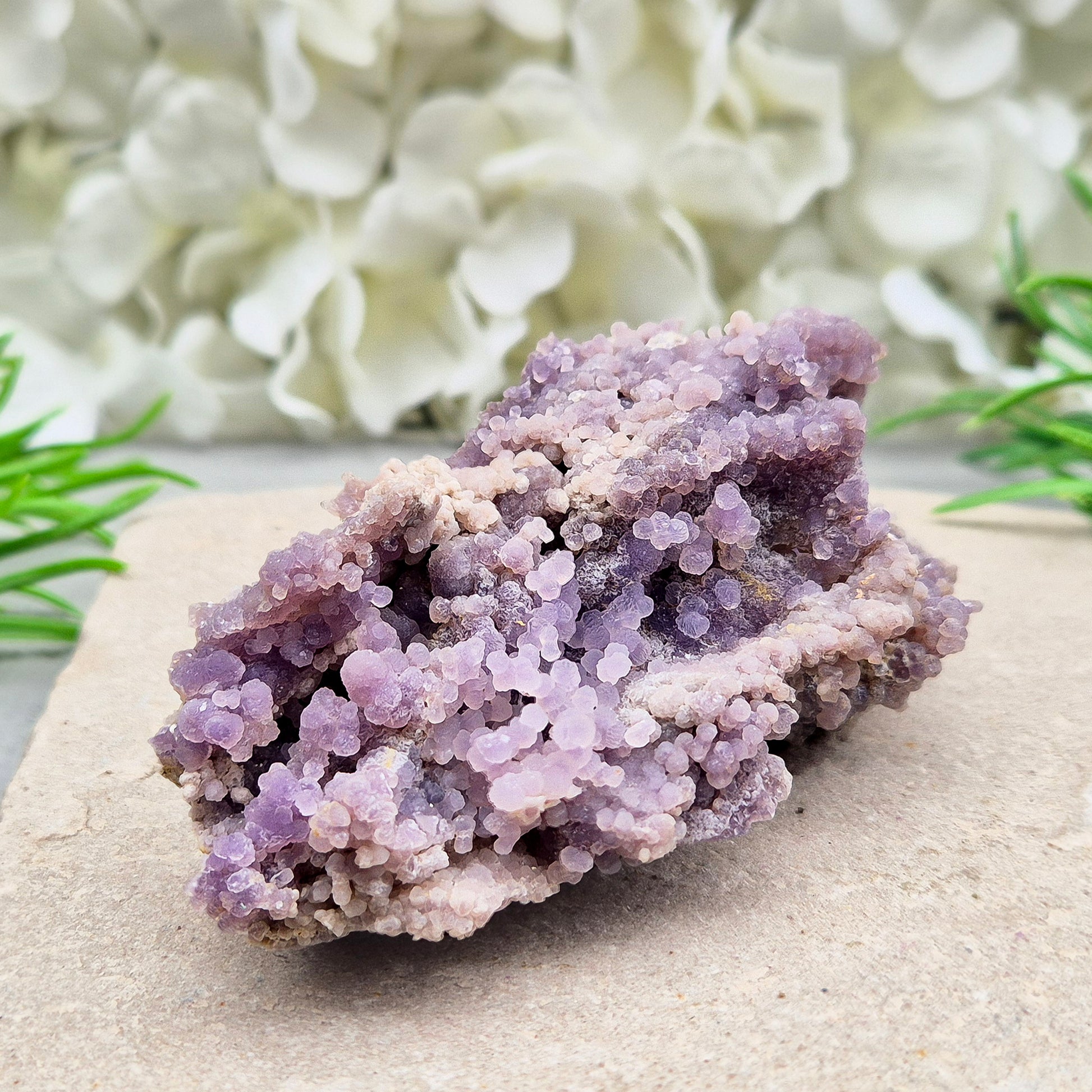 This beautiful Grape Agate cluster (also known as Purple Chalcedony or Botryoidal Purple Chalcedony) comes from Indonesia. Its natural ‘grape-like’ formations are made up of tiny rounded crystals that have grown closely together. 