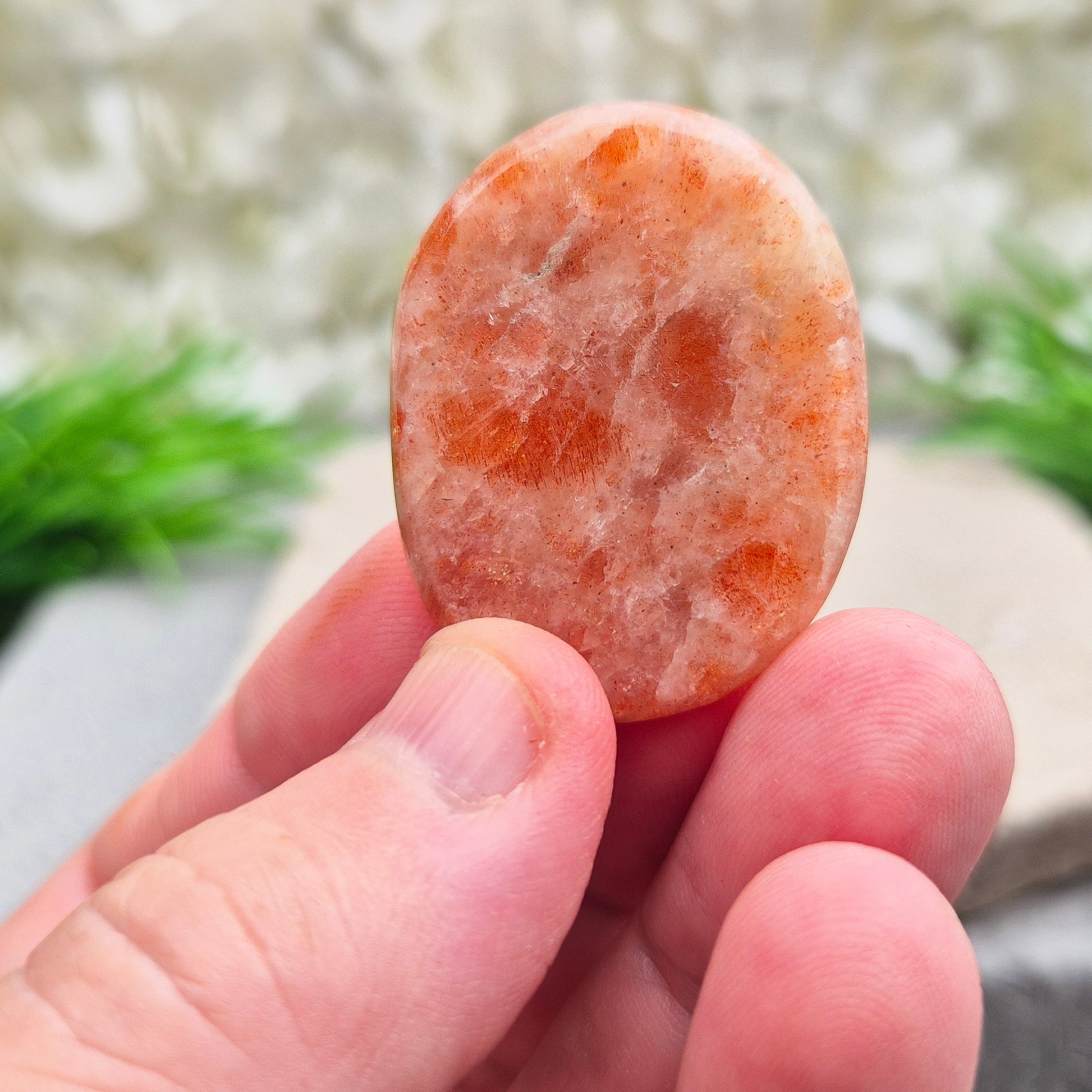 This beautiful flat Sunstone crystal palm stone features warm, peachy-orange tones and a soft, natural shimmer. Sunstone is known for its radiant, positive energy that rekindles your sense of joy, strength, and personal power. 