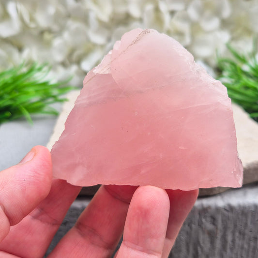 This Rose Quartz platform from South Africa is a versatile piece, with one side left natural and the other cut flat. 