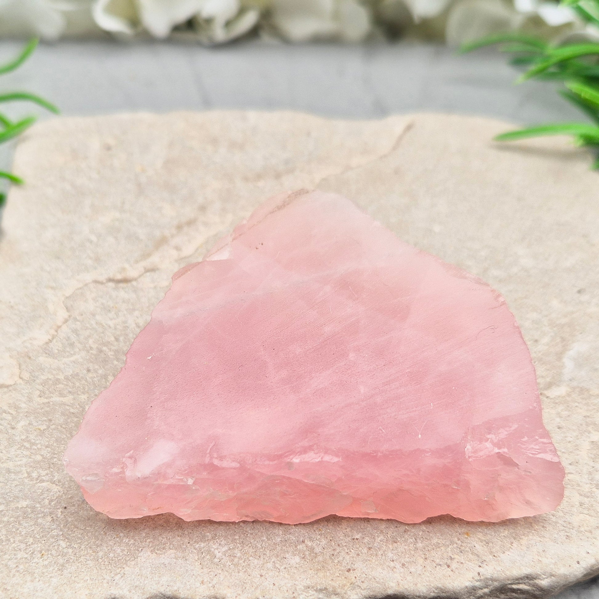 This Rose Quartz platform from South Africa is a versatile piece, with one side left natural and the other cut flat. 