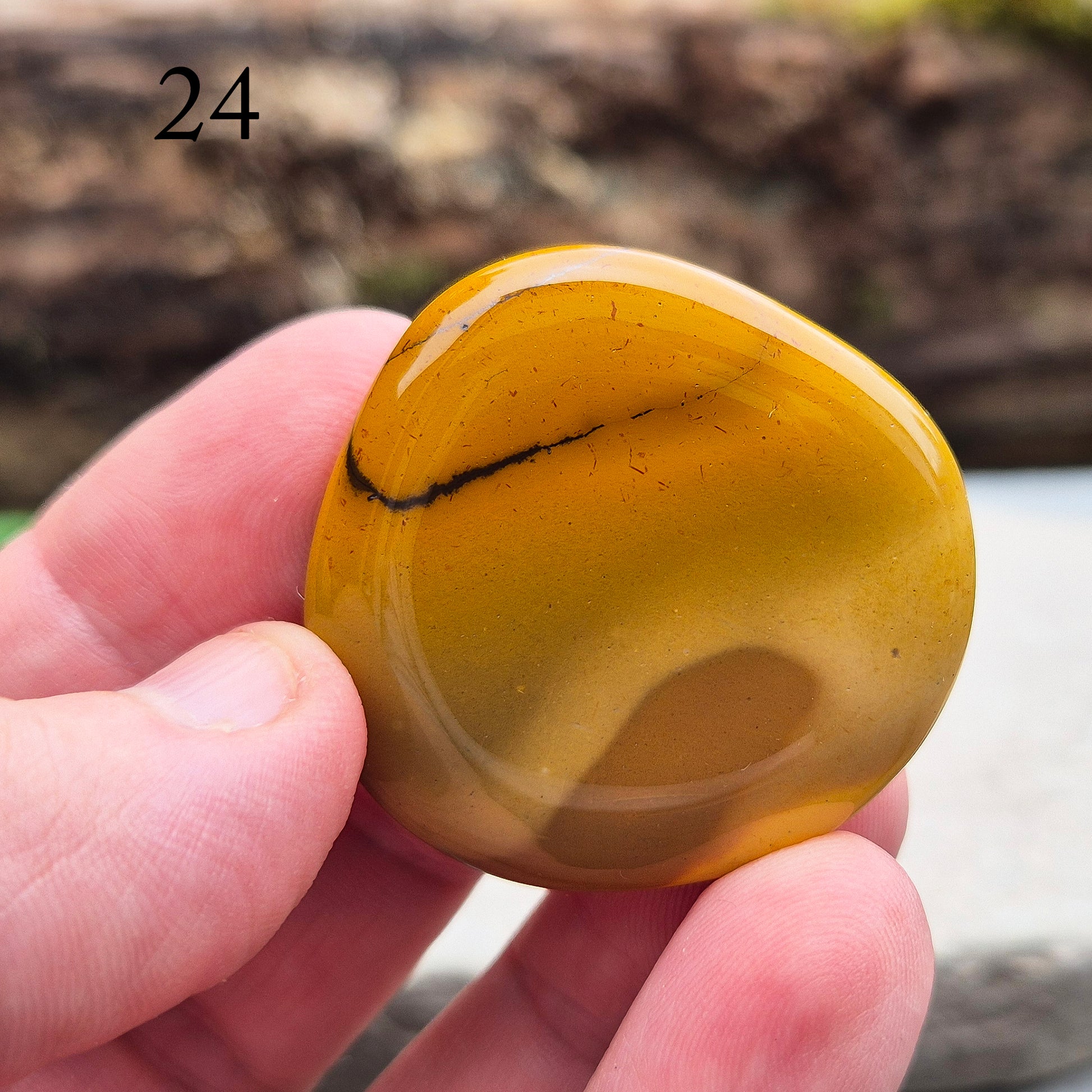 Mookaite Crystal Palm Stone. From the Mooka Creek region in Western Australia, each Mookaite palm stone displays a unique mix of earthy tones—reds, yellows, creams, and purples. 