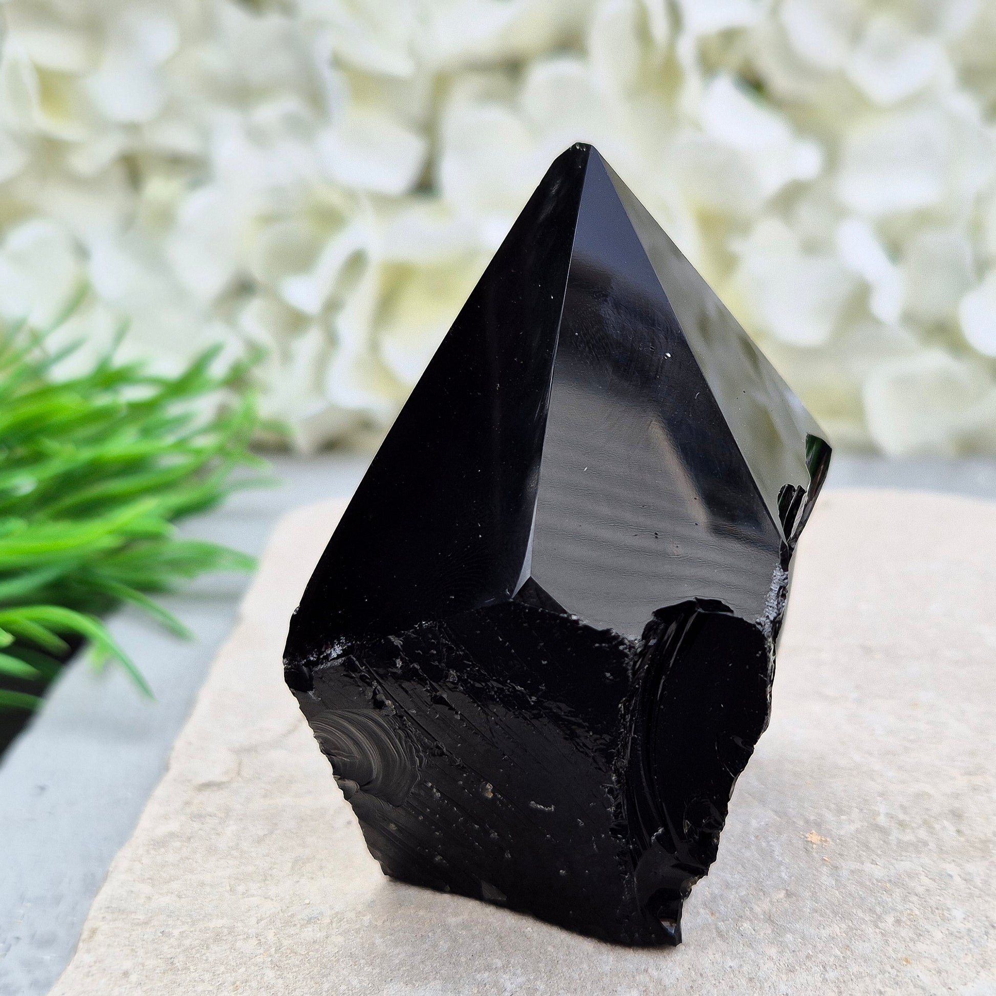 This Black Obsidian standing point comes from Mexico, point is shaped into a six-sided tip with natural sides and a cut base. 