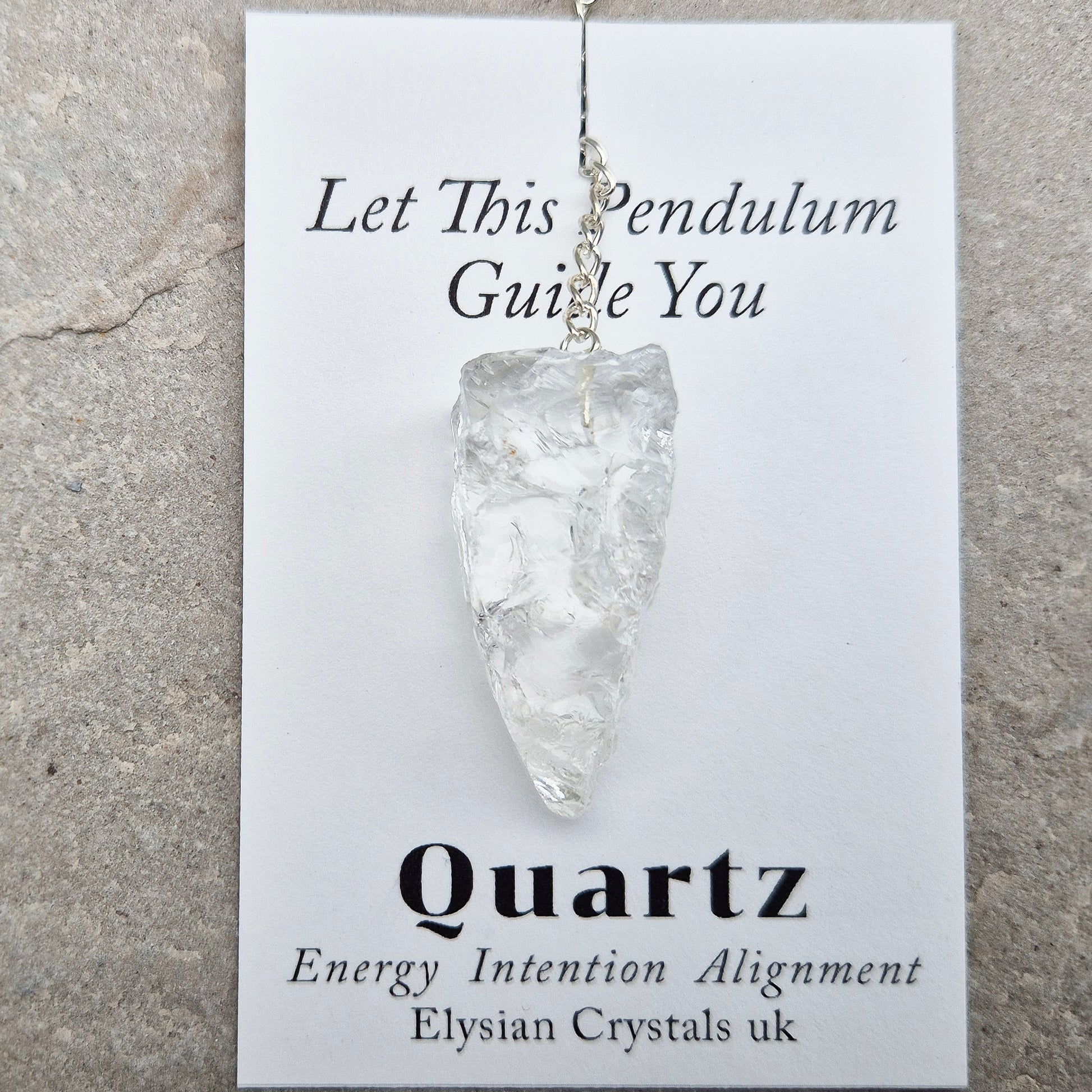 This Rock Quartz Crystal Pendulum from Brazil features a natural quartz crystal and a white bead at the end of the chain.&nbsp;It will come with a card and pouch for safe keeping. 