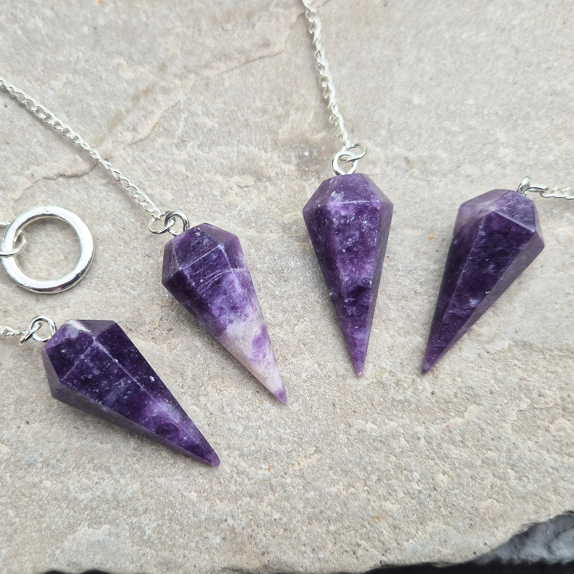 This Lepidolite Crystal Pendulum shows off beautiful deep purple colouring. Lepidolite is valued for its soothing, balancing energy – a gentle aid when working through stress, change, or emotional shifts.