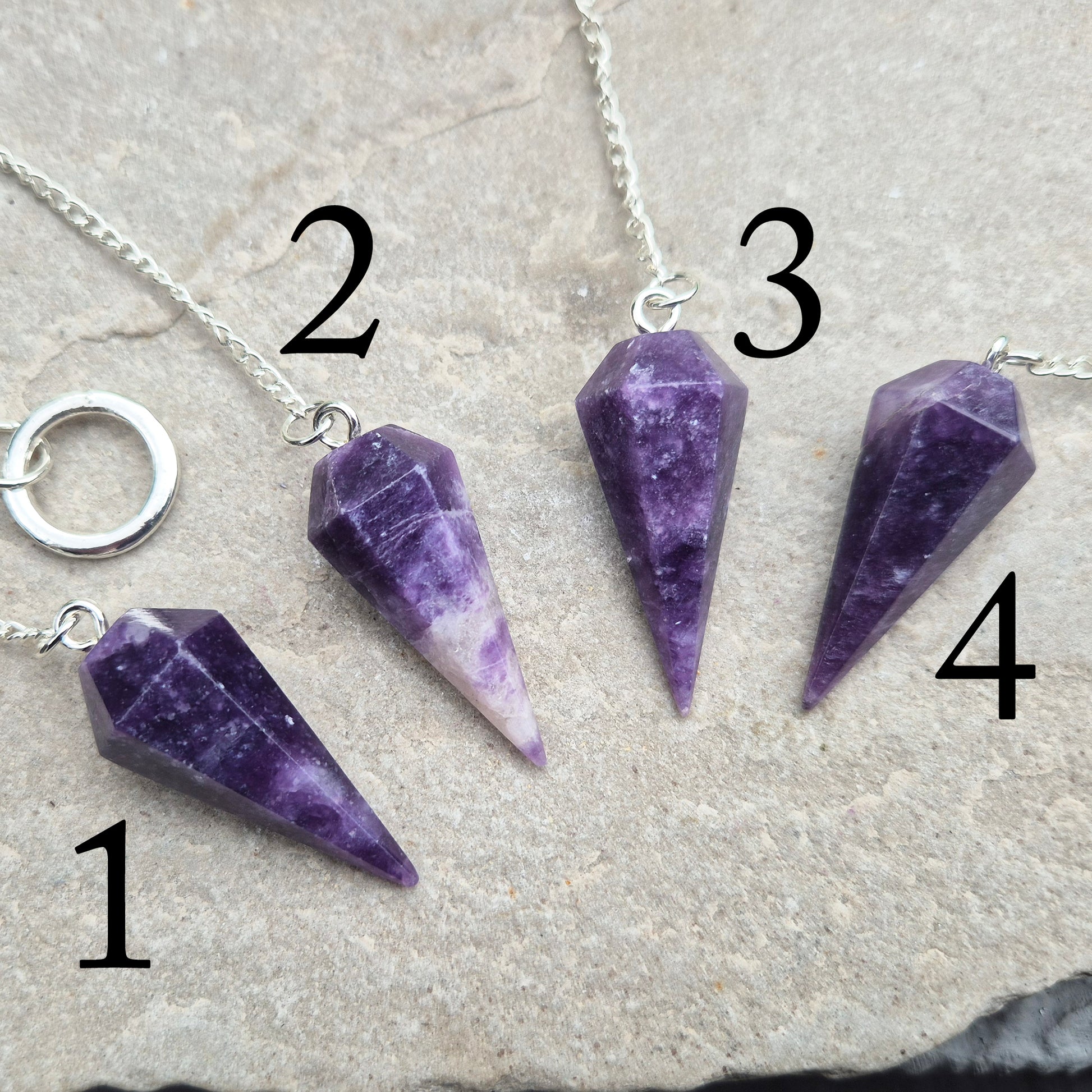 This Lepidolite Crystal Pendulum shows off beautiful deep purple colouring. Lepidolite is valued for its soothing, balancing energy – a gentle aid when working through stress, change, or emotional shifts.