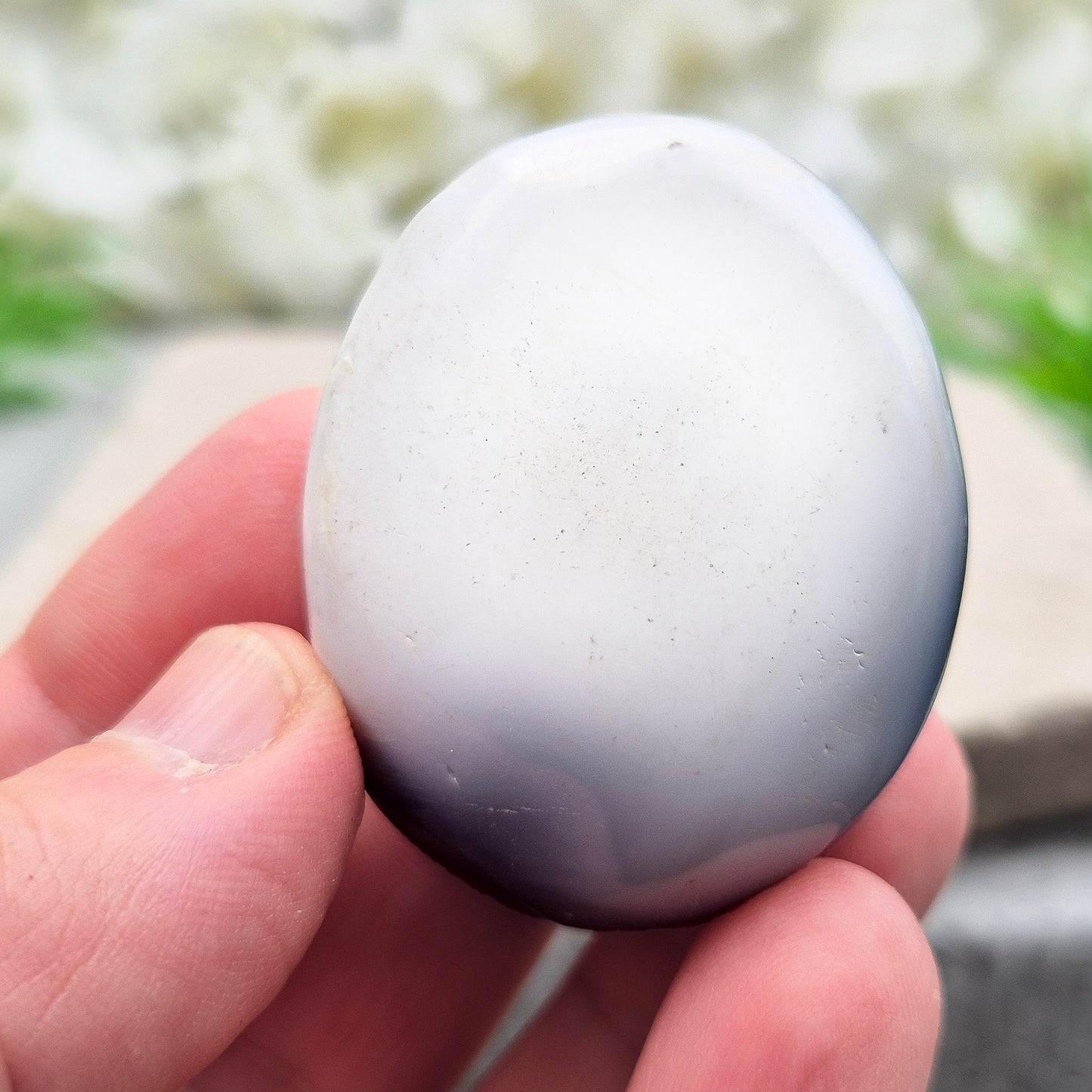Orca Agate Crystal Pebble. This beautiful Orca Agate crystal, also known as Grey Agate, comes from Madagascar and is named after the Orca whale. It has striking dark grey and white patterning and colouring. 