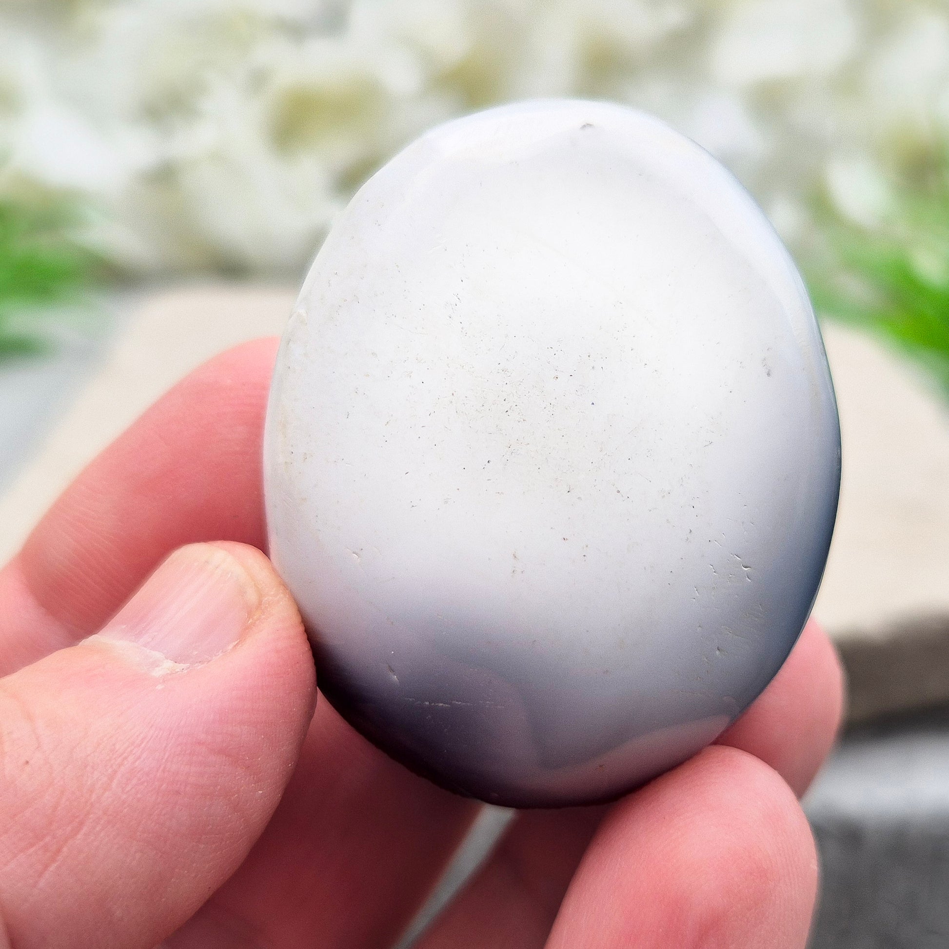 Orca Agate Crystal Pebble. This beautiful Orca Agate crystal, also known as Grey Agate, comes from Madagascar and is named after the Orca whale. It has striking dark grey and white patterning and colouring. 