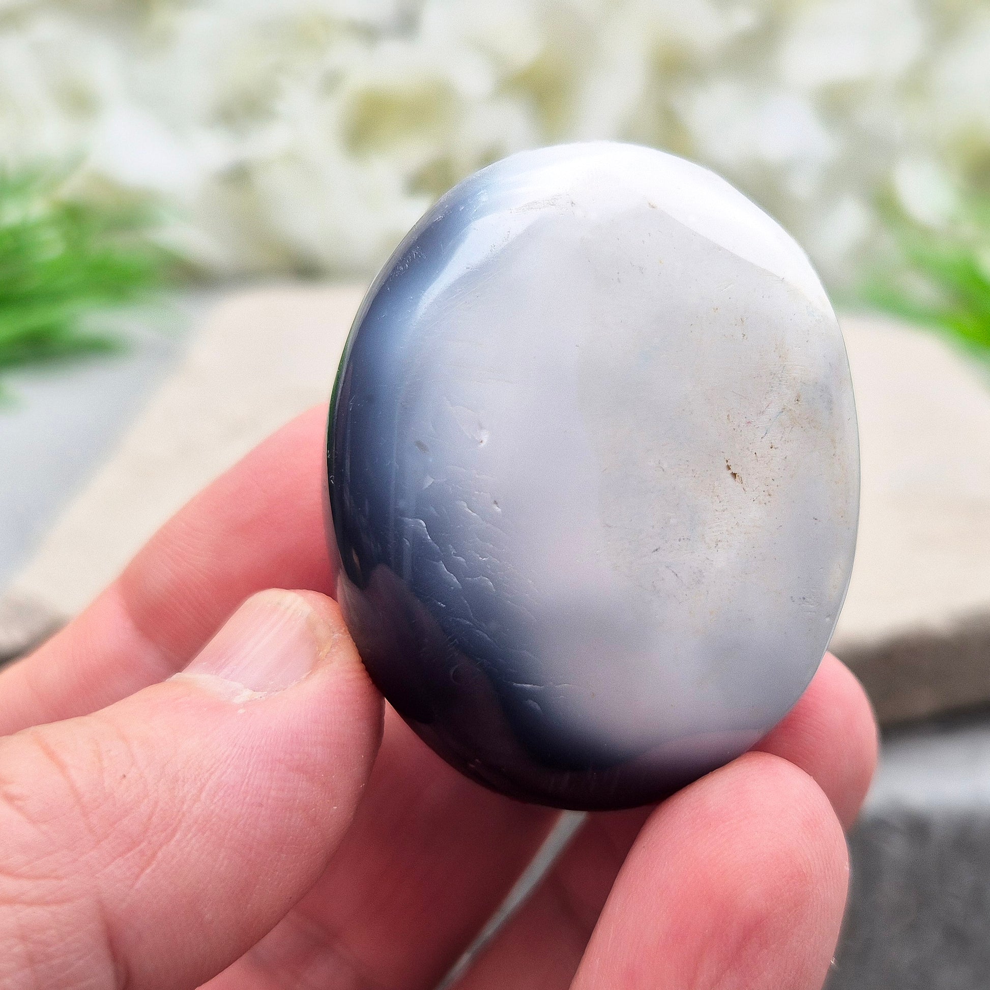 Orca Agate Crystal Pebble. This beautiful Orca Agate crystal, also known as Grey Agate, comes from Madagascar and is named after the Orca whale. It has striking dark grey and white patterning and colouring. 